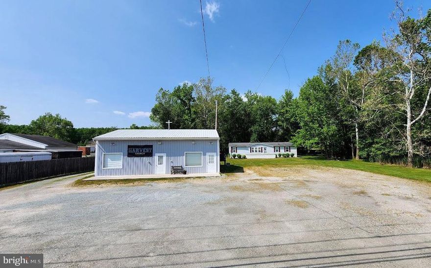 Two for One, This Property has a Prime Location on Route 40 & Offers a large 1,600+ sf Doublewide Home with 2 Bedrooms & 2 full Bathrooms. There is also a 30’ x 40’ Garage/Outbuilding that is currently utilized as a Church. The Property is lined with trees & provides Road Frontage & Access to both Route 40 & Nottingham Road. Live here & take advantage of the convenient Location with Income from the Church or convert back to the Garage. Maybe, take advantage of both Structures & Rent both & make even additional Income.  The Home could use some updating such as Flooring, Paint & Appliances. This Property offers so much Potential. Public Sewer & Water are available, the Sewer access is on the Property & the County requires the Hook-up Fees to be paid at Settlement.  Seller will only consider As-Is Offers. Take advantage this Great Opportunity along Route 40 today.