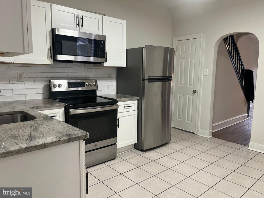 Why rent when you can BUY this charming 3 bedroom, 1 1/2 bath home with tons of space and modern upgrades! The spacious kitchen has been renovated with white shaker cabinets, stainless steel appliances and granite countertops, all while leaving enough room for a table for 2 - 4 people. The living room and dining room combo offers a great deal of natural light and tall ceilings with original arch details and a ceiling fan. Just off the kitchen, you will find a large half bath leading you to the rear yard that is great for outdoor entertaining and grilling. The upstairs features 3 nicely sized bedroom with large closets and a stylish hall bath. Each room has laminate flooring and ceiling fans, leaving with with very little to do! The basement is large and is great for extra storage and laundry, as the home comes with a washer/dryer, french drain and sump pump. And if this isn't enough, the home has been completely rewired with a 200 AMP service. With today's interest rates, you can own this home paying less than $1,500.00 (PITI) and can potentially qualify for the $18,000 Grant to cover your Closing Costs through Citadel Bank... ask us how!! Don't wait - let us help YOU become a HOMEOWNER before the holidays!!!