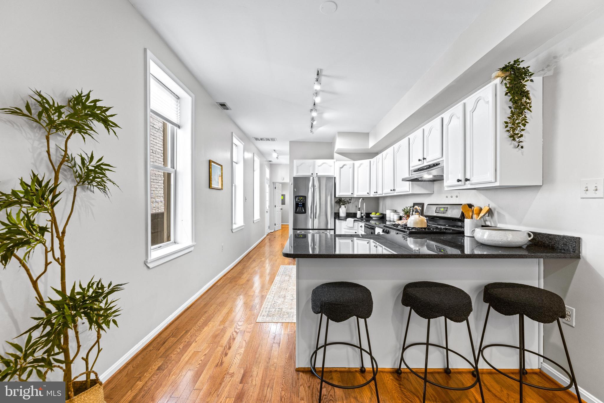 *OPEN HOUSE SAT 11-1PM* Garage? Yes. Actually fits a car? Definitely. Roof deck? Enjoy the views. Historic appeal? You've got exposed brick and beams in this 1915-constructed beauty. The part you'll REALLY love? Behind the charming, totally move-in ready, 3 bed, 2 bath 'main' house is a separate, 2-story studio with tall ceilings, perfect for an in-law/au pair suite, your business/work from home spot, OR you can keep the pristinely clean, responsible, tenant paying $1,650 of YOUR MORTGAGE EVERY MONTH, making this home almost HALF THE PAYMENT of any other home you'll see! Why have roommates share your home when instead, you can enjoy the financial benefit with the privacy of your own space? There's also an unfinished basement for storage! Lastly, this isn't a wonky rental that was updated 90 different times; it was gut-renovated and has been perfectly maintained/updated since!