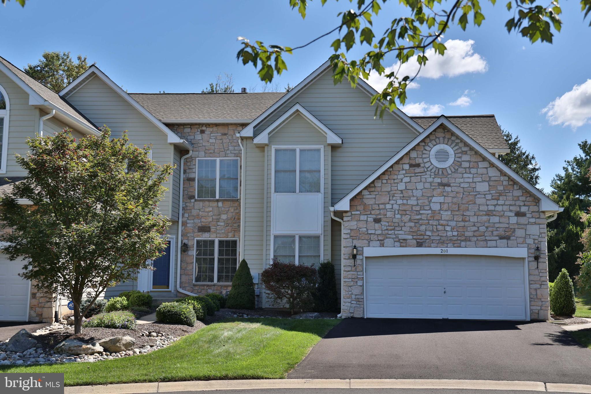 This stunning end unit carriage home, in the sought-after community of Blue Bell Country Club, offers over 3,700 sq feet of luxurious living space and an unparalleled life-style, unmatched in the Philadelphia market. For the golf enthusiast, Blue Bell CC offers a beautifully maintained 18 hole golf course with clubhouse/restaurant. Golfing not your tee? The HOA clubhouse offers outdoor swimming, basketball, walking paths, tennis and pickle ball courts. Whatever your interest, this gorgeous home is sure to please. Upon entry, notice the beautifully maintained hardwood floors found throughout the first floor before proceeding to the elegant formal dining room or the spacious living room. The eat-in kitchen is a chef’s delight! A 5-burner gas stove, granite countertops, travertine marble backsplash, French door refrigerator, barstool kitchen seating, undercabinet, recessed ceiling lights, updated stainless steel appliances and pantry, make meal prep a joy. Proceed to the family room which includes a gas fireplace with marble surround. With easy access from the family room and the living room and generously sized deck, the sunroom is a bonus feature, which is sure to fill all your entertaining needs.
The second floor offers 3 spacious bedrooms and two full bathrooms. Double door entry leads to the owner’s suite, which features a vaulted ceiling and walk-in closet. High-end finishes in the owner’s bathroom include river stone floor, tile back splash, frameless shower door and granite top vanity with double sinks. Two other generously sized bedrooms, plus a full bath complete the second floor.
Need more space? The finished basement, with extra storage space, offers you an opportunity to personalize to best suit your needs. Currently it is configured as a home office, workout area and relaxation area, plus a wine room, complete with slate floors, custom made cabinetry and shelving.
Living at Blue Bell Country Club becomes more than your home. With all of its amenities, it is a lifestyle that can fill your recreation desires from a toddler to maturity. Come and see all this home and community offer!