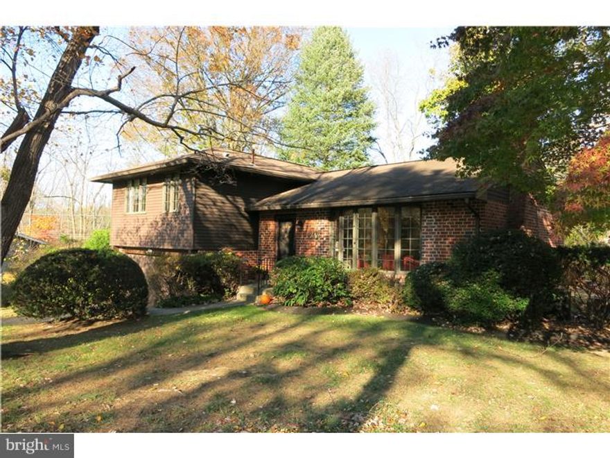 Pride of ownership abounds in this beautiful 3 Bedroom, 2 Bath single nestled in a tranquil setting in one of the area's loveliest neighborhoods. Meticulously maintained, this home is move in ready. Elegant Hardwood Floors are found in the Living Room, Dining Room, 3 Bedrooms and Hallway/Stairs. The main level features a welcoming Living Room with a large bow window that floods the room with natural illumination and offers a picturesque view. Enjoy the warmth of the brick wood burning fireplace.  The Dining Room includes a chair rail plus a slider to a spacious deck overlooking the mature treed backyard and breathtaking grounds. A large Kitchen with a Breakfast Area features Bosch appliances and plenty of room for friendly gatherings. The second level includes an abundant sized Master Bedroom with a walk in closet and a newer Full Bath including tiled flooring. Two other spacious Bedrooms are adjacent to a recently renovated Hall Bath which includes a ceramic tile floor.  A cozy large Family Room has outside access through another slider that allows plenty of light and a beautiful view of the backyard.  Pull right into the two car attached Garage that leads to a large Basement with abundant storage. Additional storage in a backyard shed.  Pella windows throughout.  Second level AC April 2014. Reasonable taxes, Wissahickon School District.  Conveniently located to trains stations, Turnpike, Routes 309 and 476. Minutes from down town Ambler, restaurants, shopping.