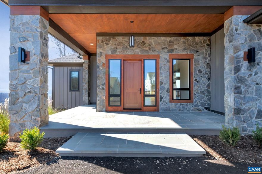 Stunning 1 year old contemporary home in the sought after Ashcroft Community. The stone pillar flanked front entrance with bluestone floor respectfully complements the stately sapele mahogany door with 3 point lock system. Upon entering the foyer an expansiveness of glass reveals mountain views, inviting dining room with fireplace, beam clad great room, kitchen boasting high end appliances and artfully designed staircase to terrace level are welcoming sights.  Pella Windows, fine trims, hand laid hardwood floors, custom designed tile, quartz countertops. state of the art Cat 6a wiring system, Trex deck floor, Toto toilets, thermostatic valve in master shower system and so much more. (see feature sheet)  MOUNTAIN VIEW & CLOSE PROXIMITY TO DOWNTOWN CVILLE, UVA AND PETER JEFFERSON PLACE.,Quartz Counter,Wood Cabinets,Fireplace in Dining Room,Fireplace in Family Room,Fireplace in Living Room