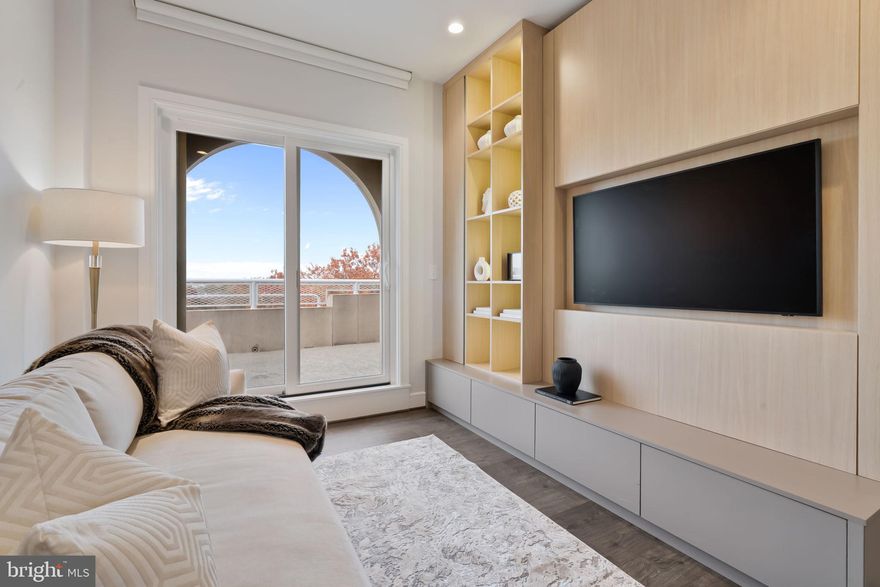 *Seller offering a $20,000 buyer incentive for contracts ratified by 2/28. Can be applied toward closing costs, rate buy-down, or purchase price.
Introducing The Penthouse at Towngate North — a rare opportunity to own a truly exceptional residence with unobstructed views of the DC skyline and Potomac River from a private terrace. Flooded with natural light, this 2023 designer-curated penthouse has been thoughtfully reimagined with bespoke modern upgrades that rival today’s new construction.
The open-concept living space is anchored by an Italian quartz waterfall island and a full JennAir appliance suite, while the living area features an imported Italian onyx porcelain statement wall with ambient, customizable lighting and a water-vapor art display — a striking focal point unlike anything else in the market.
Throughout the home, you’ll find custom millwork, concealed storage, integrated lighting, remote shades, and art-ready wall treatments. Bedrooms offer custom glass-front closets, and spa-inspired baths showcase floor-to-ceiling tile, waterfall quartz vanities, smart LED mirrors, and heated towel bars. Smart-home features include Sonos surround sound, Lutron dimmers, Brilliant wall controls, and Eero Wi-Fi.
Residents enjoy a fitness center, rooftop terrace, resident lounge, meeting rooms, dog wash, and two garage parking spaces (one EV-ready). Ideally located in the heart of Old Town Alexandria near the Mount Vernon Trail, acclaimed dining, and boutiques, with easy access to DCA and Washington, DC.
A rare penthouse offering with views, design, and now a compelling incentive — private showings encouraged.