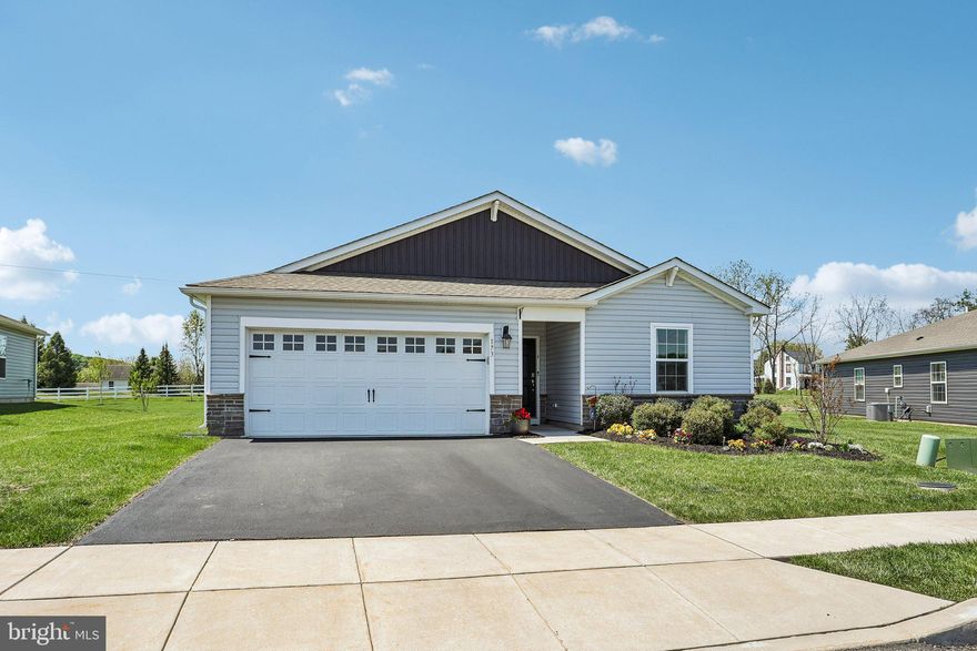 Welcome to this beautiful single-family ranch home in the highly sought-after 55+ community of Pottsgrove Hunt! Situated on a larger lot and backing to open common space, this home offers privacy and peaceful views with no rear neighbors. Enter from the front porch and into a bright, open-concept floor plan filled with an abundance of natural light from the many oversized windows. The spacious kitchen is the heart of the home, featuring Quartz countertops, stainless steel appliances, a walk-in pantry, and a large center island with seating, all overlooking the dining area and living room — perfect for entertaining and everyday living. Sliding glass doors off the dining area lead to the backyard, where you can relax and enjoy the scenic open space behind the home. The private primary suite is thoughtfully tucked away at the rear of the home and features a walk-in closet and an ensuite bath with a dual vanity and a walk-in shower. Three additional bedrooms are located toward the front of the home and share a full hall bathroom, offering flexible space for guests, hobbies, or a home office. A dedicated laundry room and convenient access to the attached two-car garage complete the interior. Residents of Pottsgrove Hunt enjoy exceptional community amenities including a clubhouse, fitness center, tennis and pickleball courts, and walking/running trails. Conveniently located close to major highways, shopping, and dining, this home combines low-maintenance living with comfort, convenience, and an active lifestyle. Mortgage savings may be available for buyers of this listing.