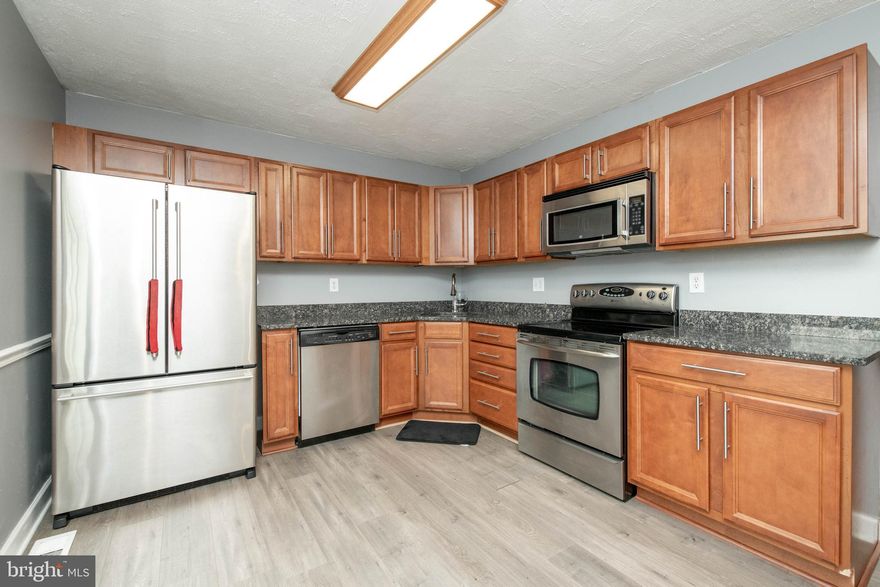 Great Opportunity To Own This Spacious Three Level Townhouse With Three Bedrooms and Two Full Baths.   The Finished Basement Featuring French Door Which Leads To Your Remodeled Family Room And The Sliding Glass Doors Opens To The Back Yard.  This Is A Fantastic Area  For Spring & Summer Barbecues-Cookouts.  The Basement Also Has A Full Bath, Front Loaded Washer And Dryer, Storage Space For Extra Boxes.  The Second Level Is An Open Space Living-Dining Room Combo With Laminate Flooring.   The kitchen Is Equipped With Stainless Appliances, A Sliding Glass Door That Opens To Your Deck Right Off The Kitchen.   The Third Level has Three Bedrooms Along With A Full Bath And Carpet Flooring.   This Location Is Great For Commuters And Has Easy Access To Major Shopping At White Marsh Mall-Mixed Used OutDoor Area. Make This Your Home Today.   Open House On Sunday, March 15, 2020, From 12:00 Pm To 2:30 Pm.