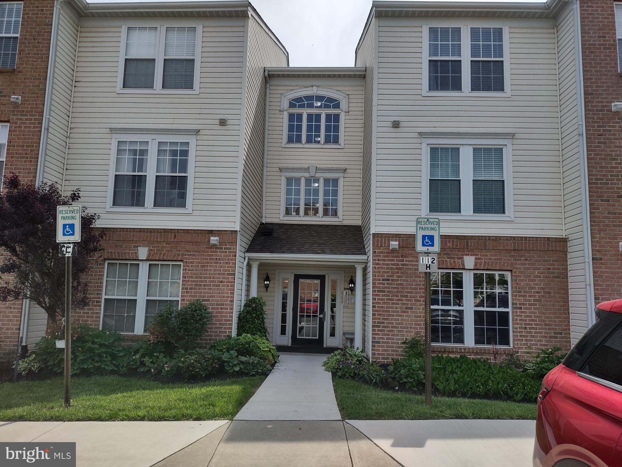 Ground level unit at the Bayland Condominiums in Grace Harbor. Entrance foyer with a walk-in closet that opens to the living/dining area. Large primary bedroom with private bath and walk-in closet. The hall bath has dual entry from the foyer and from Bedroom No. 2. Enclosed rear patio overlooking the common lawn area and trees. Community amenities include club house and swimming pool. See MLS documents for detailed brochure and Seller disclosures.