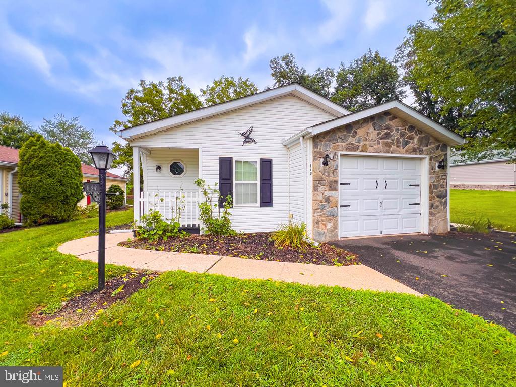 Welcome home to 629 Sassafrass Ct. This Buckingham Springs well maintained home backs to farmland and offers a peaceful and quiet setting to enjoy year-round. It features spacious living and dining rooms and a well equipped eat-in kitchen. Recent updates and improvements include a new HVAC system (installed March 2024), a freshly painted front porch, and new professionally installed flooring in the kitchen. The enclosed patio features 4 sliders, offering endless opportunities for relaxation and entertaining. This property includes 2 bedrooms, 2 full bathrooms, and a laundry room. The home also has an attached oversized one-car garage. Simplify and enjoy this vibrant over 55 community of Buckingham Springs with many amenities and activities to enjoy, including a pool, clubhouse and fitness center. This community is only minutes away from New Hope, Peddler's Village, Doylestown, and Newtown, ready for you to explore dining and a variety of attractions.