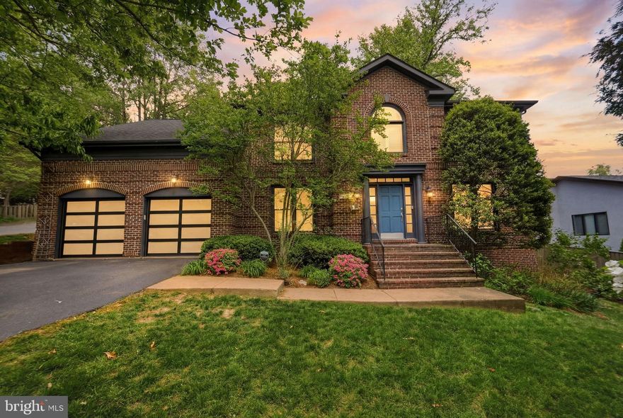 Exceptional North Arlington residence on a rare 0.37-acre lot, offering nearly 6,000 sq ft of thoughtfully designed living space, minutes away from Georgetown and Downtown DC. This beautifully updated two-story home with a finished basement, located within a quiet and leafy cul-de-sac, blends a timeless and distinctive exterior with modern upgrades. Featuring 6 bedrooms, 4.5 baths, and multiple flexible living areas, including space for two home offices, and an expansive recreation basement level, the home provides versatility for today’s lifestyle. The broad wood deck flanked by a landscaped yard sets the stage for effortless indoor-outdoor living. Extensively improved with approximately $500,00 in renovations, the home showcases a designer kitchen featured in interior publications, updated systems, and high-end finishes throughout. The upper level is designed to maximize natural light, featuring high-efficiency sun tunnels. The kitchen features custom cabinetry, bespoke Venetian glass lighting, a wine bar, and refrigerated wine cabinets for 350 bottles, smart home features, and abundant storage. Additional highlights include a 2-car garage (new smart doors from 2025), updated HVAC systems (2025), energy-efficient windows, and professionally maintained landscaping with irrigation. Ideally located in the heart of North Arlington with easy access to DC, airports, major commuter routes, and parks, this home offers space, privacy, and convenience in Lorcom Grove, one of the area’s most sought-after neighborhoods. A rare opportunity to own a renovated, large-lot home in prime North Arlington—where space, location, and quality converge.