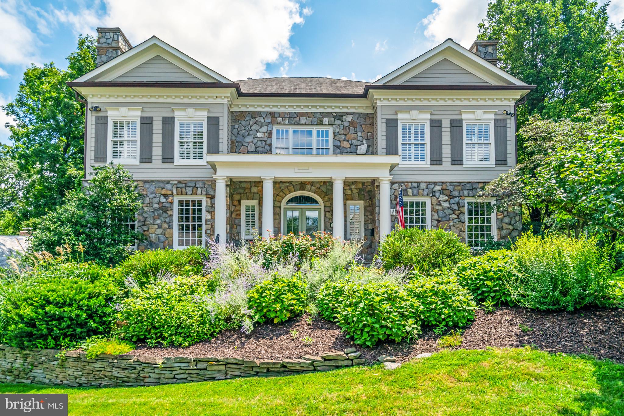 Exquisitely designed and decorated Georgian Colonial, custom built by renowned builder John Joy, offering over 7,000 sq ft of luxurious living space on an oversized lot backing to Windy Run Park. This sun-filled, three-level masterpiece features high coffered ceilings, elegant crown moldings, custom millwork, and gleaming hardwood floors throughout. The gourmet kitchen is a chef’s dream with double islands, Viking and SubZero appliances, and plenty of bar seating—perfect for entertaining.
The main level includes a cherry-paneled study, formal living and dining rooms, and a spacious family room with a gas fireplace and park views. Upstairs, the gracious primary suite features a private balcony, a spacious bath with soaking tub, walk-in shower, double vanity, and an expansive dressing room. Each additional bedroom offers an ensuite bath and generous closet space.
The walk-out lower level is designed for recreation and relaxation, featuring a fully equipped lounge and bar, billiards area, family room with fireplace, private home theater, and direct access to the beautifully landscaped backyard and patio. Additional highlights include four gas fireplaces, a three-car attached garage, and meticulous attention to detail throughout.
Located on a quiet cul-de-sac just minutes from the GW Parkway, Washington, D.C., and Arlington’s top shopping and dining destinations, this exceptional home combines timeless elegance with modern comfort in one of Arlington’s most desirable neighborhoods. Don’t miss this rare opportunity!