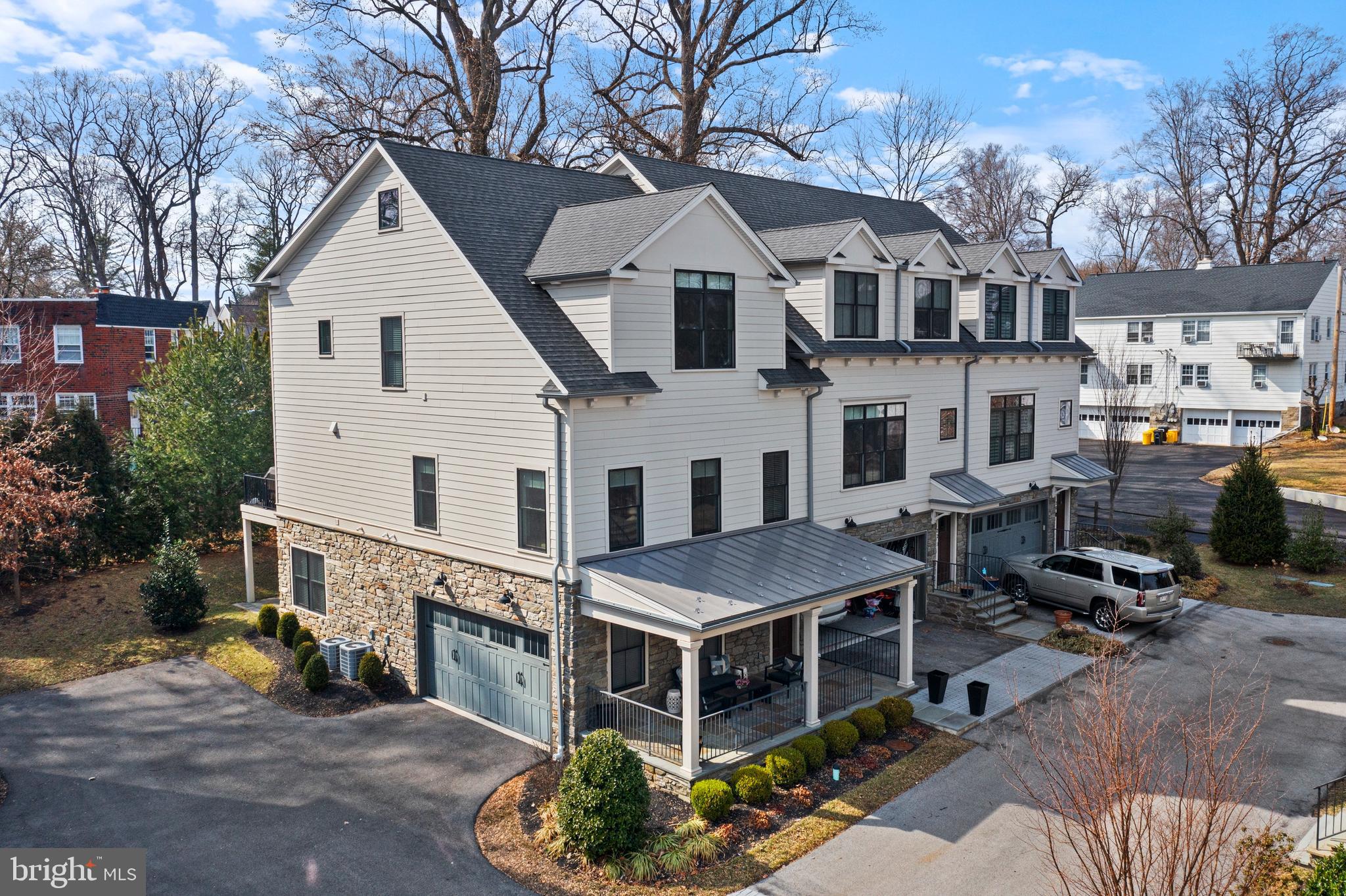 Welcome to 24 Price Avenue, nestled in the charming neighborhood of Price Crossing, Narberth’s best-kept secret. This former model home is equipped with a full home elevator. Built by Vincent P. Sposato in 2019, this home is part of a boutique community of nine luxury townhomes, offering the perfect blend of low-maintenance urban living and sought-after privacy. Walking distance to Narberth's restaurants, SEPTA train station, shops, and two public parks, this home is perfectly positioned for convenience. The thoughtfully designed outdoor spaces include a flagstone front porch, a spacious deck off the kitchen, and a lower-level walk-out patio. This home features three bedrooms, each with its own ensuite bath, plus two additional powder rooms. Inside, the details make a lasting impression with hardwood flooring, custom lighting, shiplap walls, ceiling fans, built-in speakers, and custom millwork. The living room, flooded with natural light, exudes modern elegance with a gas fireplace framed by custom bench seating and a shiplap wall. The powder room off the living room adds to the functionality of this space. The state-of-the-art kitchen features 42” custom white cabinets paired with darker cabinetry on the island, complemented by quartz countertops, a matching backsplash, and under-mount lighting. The kitchen seamlessly flows into the dining room, creating an ideal setting for both cooking and entertaining. The dining room with shiplap wall and modern lighting makes a statement. The dry bar, with extra storage and floating shelves, adds to the home's appeal. The deck offers a tranquil space surrounded by natural privacy from mature trees. On the next level, the primary suite includes a custom-fitted walk-in closet, hardwood flooring, and a ceiling fan. The ensuite bath, designed in calming natural tones, features a dual vanity and heated floors. The ceramic tile walk-in shower features a glass door, rainfall showerhead, and a full bench for added comfort. The laundry room, equipped with a sink and additional storage, adds practicality to this level. Down the hall, the second bedroom welcomes you with an oversized window and generous closet space. The ensuite bath features a sleek white tiled shower with a frameless glass door. The oversized third bedroom is a private suite, offering generous space and abundant natural light. The ensuite full bath features a tub/shower combination.There is also additional storage space on this level. The lower level provides versatile space, perfect for creating a combination of rooms to suit your needs, complete with a powder room. Sliding glass doors lead to a stone patio, extending the living space outdoors. The two-car side-entry garage has storage closets and a hose bib. The exterior is finished with durable James Hardie Plank siding, oversized black-trimmed Pella double-hung wood windows, and a metal standing seam roof over the covered porch.