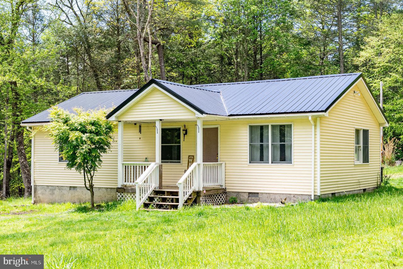 If you are looking for a turn key getaway in beautiful Pendleton County on nearly 3 private acres, YOU JUST FOUND IT! Well maintained with a brand new metal roof (2025) and recent interior improvements, this cozy home is just right for a family looking for an affordable home or for an investor. Short drive to many attractions including National Forest, public lakes, and rivers. Make this your full-time residence or your second home to just enjoy the peace and tranquility of those WV mountains. Get your appointment scheduled today! Vacant and easy to show!