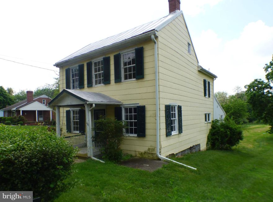 IF YOU LOVE HISTORY….get ready to step back in time as you walk through this quaint 4 bedroom, 2 bath Colonial located in Historic Uniontown.  It is described as having been built between 1810 and 1813 by David Stem and this home is one of several homes nominated to the National Register of Historic Places.  The tax assessment of 1837 lists this property as being “one of two log houses owned by John W Swartzbaugh at that time.  The house retains the basic appearance and details of a two-story log house from this period”.  It features a main level bedroom with both a full bath and a laundry area, three bedrooms with a second full bath on the upper level, and this home is situated on a spacious .5 acre lot.  Come see it today and get ready to renovate to make it your own!