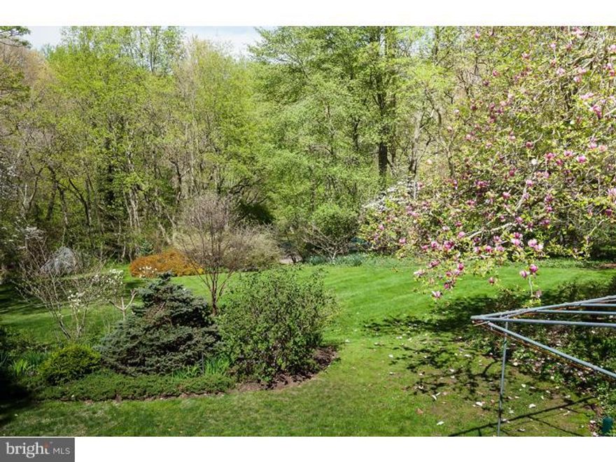 Called "LA GALERIE" because of the dialog between indoors and out, this ROMANTIC property is not a drive-by! You can't see it from the road! Down a private drive, completely SECLUDED you'll find SOMETHING SO SPECIAL! An exceptionally LOVELY property, consisting of 3.37 acres of specimen trees and captivating gardens that will take your breath away: a true refuge on the MAIN LINE yet literally minutes to Gladwyne(1 mile to the Guardhouse), Narberth, Ardmore and Routes 76 and 476! Natural sunlight shines through the plethora of windows and French doors in this CLASSIC Walter Durham home(including family/great room addition by Durham in 1951) which has been beautifully modernized, lovingly cared for and UPDATED over the past 21 years by the current owners. At one end of the house the kitchen with GRANITE ISLAND, stainless steel appliances and countertops galore, adjoins the butlers pantry, a seven-sided breakfast room, first floor laundry, backstairs, a full bath and spacious mudroom which leads to the garages, barn and a rear parking area. The CLASSIC black and white marble-floored CENTER HALL and main staircase separates the GRACIOUS Dining Room from the Living Room which has an Antique FP mantle. The quiet Library, off of the LR has a step down WALK-IN fireplace and French doors to private terrace.  Beyond the LR lies a brick-floored ante room and formal PR leading to an impressive 30' x 17' Family/Great Room with soaring Tray Ceiling, Huge Fireplace, Wet Bar, and curving secret staircase to the Master Bedroom, completing the first floor.  ENJOY privacy and views from the Master bedroom suite with another FP, his and her walk-in closets,  a dressing area, balcony and an exterior "Bermuda" staircase overlooking the grounds.  The spacious MARBLE MASTER bathroom has a double vanity, shower and soaking tub. Four additional bedrooms, 3 baths and an additional front balcony complete the second floor. Recent improvements also include a HANDSOME, NEW wood shingle roof. This ELEGANT home has C/A and a tucked away pool with huge patio, brick terraces, a large awning and two attached garage spaces as well as a four stall barn with additional parking. Amidst majestic trees and perennial gardens, it's hard to believe how QUICK and CONVENIENT the location is: within 5 minutes access to 76 (Gladwyne exit), GLADWYNE, Narberth,  Ardmore, Haverford AND Bryn Mawr! RENOWNED Lower Merion Schools. ONE-OF-A-KIND property! A JOY TO SEE! Be the next fortunate owner!