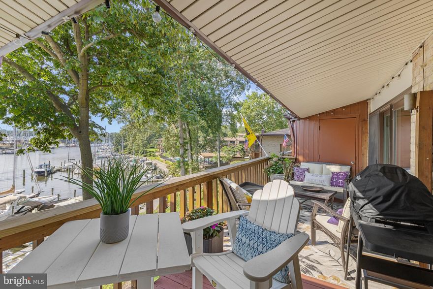 Waterfront Condo with exceptional water views: Experience the ease of a lock-and-leave condo lifestyle combined with the luxury of a 30' deeded boat slip (C2) on Back Creek which flows into the Severn River. Relax or entertain on the expansive outdoor deck where you and your guests can take in exceptional water views. This recently updated condo has all the improvements a buyer is looking for. The elegant white kitchen features beautiful granite countertops and solid wood cabinetry. Recessed lighting throughout the living space with higher base boards and crown molding. Luxury vinyl plank flooring throughout with upgraded insulation for sound. Bohan construction enhanced this unit with a private laundry room with full size washer and gas dryer,  double sinks in the primary bathroom with plantation shutters in both bedrooms, barn door access to the oversize closet, sun shower and handheld faucets in the oversized Walkin shower with porcelain tile. The second bedroom could be used as office space, exercise room, TV or space for quietly reading a book. There is ample storage space in the condo along with a storage cage on the lower level where you can keep your boating supplies and a rack for your bicycle. Severn House offers fantastic amenities, including rentable canoe, kayak, and paddle board racks, EV charging stations, waterside park, and outdoor grilling areas. The waterfront pavilion by the community pool also features tables for outdoor dining and entertainment. Located just minutes from Eastport and Downtown Annapolis, residents can easily enjoy vibrant shops, renowned restaurants, and cultural attractions. Please note that pets are not allowed in this community. Gas and water are included in the condo fees. Don’t miss this rare opportunity to enjoy the waterfront living in a stylish, move-in-ready home!