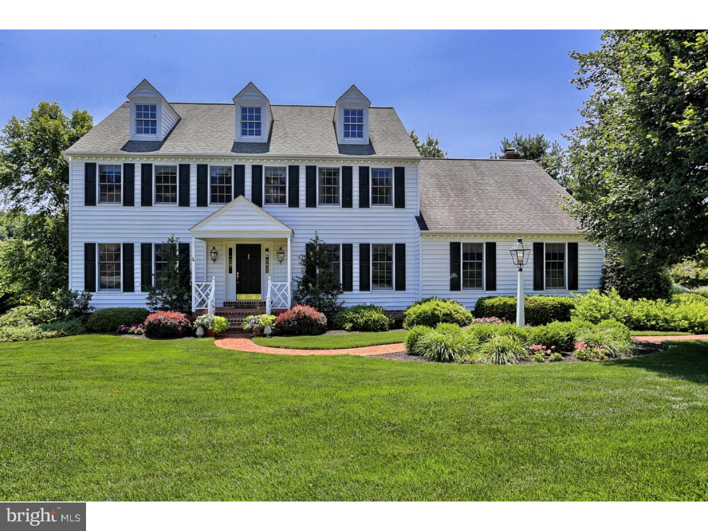 This home by Legacy Builders has inspiring views with upgrades and amenities, including a kitchen with a Jenn-Air oven, Bosch dishwasher, a built-in desk, and Corian counters with granite on the island. Natural light pours into the sunroom, while the finished basement has a wet bar, patio access, and a climate controlled 700+ bottle capacity wine cellar. The master suite has a bath with a soaking tub, granite counters, and a nearby sitting area. All three baths have been remodeled, and the lower level also has numerous built-ins and closets for storage. Other features of the home include an elegant dining room that offers wainscoting and a bay window, as well as a family room with a gas fireplace. An office has stately built-in shelves and a desk, both in cherry. Along with the sunroom, a deck outside provides tranquil views of the impeccably-landscaped lot that is over half-an-acre in size.