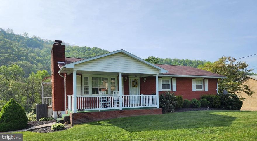 Charming one level all brick home in the country, boasting of all hardwood floors, 3 Bedrooms, 2 1/2 baths, central A/C, 2 car garage, sun room, fieplace, partialy finish full basement, situated on  .94 acres beautifully landscaped, large parking area,  uptated kitchen, 2 heating systems, roof, and windows.  Close to health care, shopping and endless outdoor activities.  Don't miss this one!