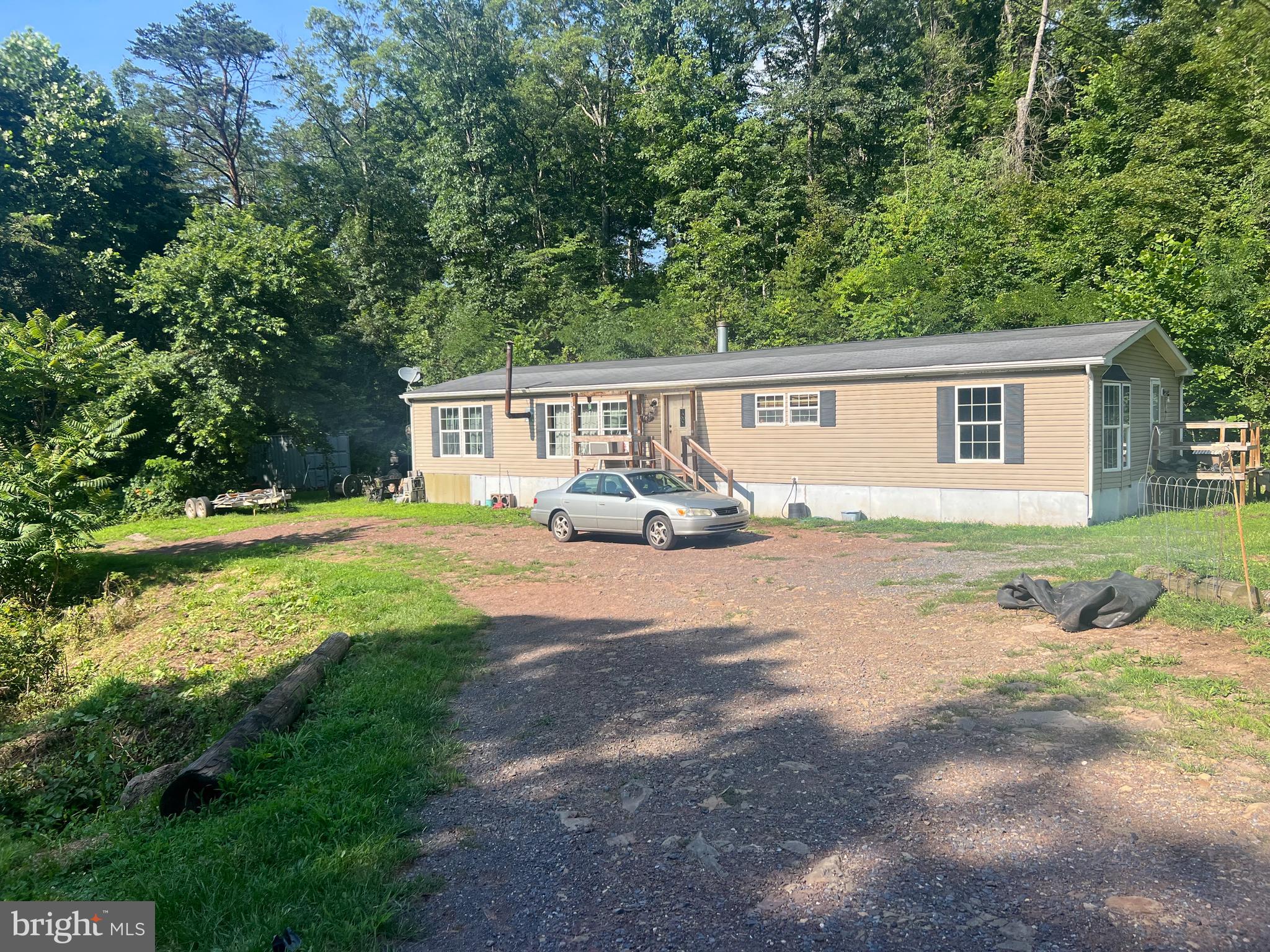 Nice home on 2.5 UNRESTRICTED acres ! Land is level all usable and has a nice decent sized pond on it ! Easy access to this secluded yet not remote nice corner lot right off hard cap Winchester St . Totally private yet minutes to the town of Paw Paw and 20 minutes to Berkley Springs make this an ideal location ! Home itself was built in 2008 featuring 3 bedrooms/2 baths , nice fireplace, wood-burning stove and forced air heating . There is also an old house on the property but it is of no value. Great location in beautiful Morgan co WV so see this one first ! Gaze at the night sky, build a fire and chill by the pond, and enjoy the best of Wild, Wonderful WV! Priced to sell at $179,900 so go see this great property today because its sure to move quickly !!