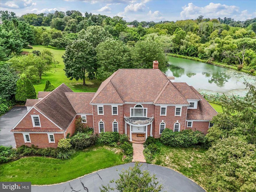 Every once in awhile a special home comes along.  Let me introduce you to 1015 Lambourne Road!  This stately colonial is in a fabulous location in the heart of Radley Run.  Situated on 8 acres with a pond this property is ready for a lucky new owner!  Spend your free time roaming your land or paddling on your own water.  This home was custom built and loved by the family who was raised here.  Lambourne Road is a unique little cul-de-sac street with just seven homes all of which have at least 2 acres.  This home is the gem at the end of the cul-de-sac! This classic brick home boosts a fabulous foyer with a turned staircase as you enter the home. The foyer opens to the family room at the rear of the home as well.  Flanked by the huge living room and dining room, the foyer is a great welcoming entrance.  The dining room is very large with beautiful crown molding, chair rail and hardwood flooring.  It flows seamlessly to the gourmet kitchen which will delight all cooks and bakers!  The warm cherry cabinetry invites you in to prepare your family meals or to prepare fun dishes for special guests.  The island is very large and allows for great food prep.  The range is top notch and the subzero refrigerator complements the working space of the kitchen.  There is a large eat-in area of the kitchen and the windows and door to the back patio make it easy to take in the backyard wonderland.  The family room is the center of the home with a soaring stone fireplace.  Make a fire in the winter and enjoy the amazing views of your new oasis.  There is a gorgeous office with a fireplace next to the family room and wood finishes of the room are gorgeous!  The living room is quite large.  You could enjoy after dinner drinks here or enjoy a quiet space for reading. The primary bedroom is in the east wing of the house.  This room is huge and if offers a sunroom with windows galore to take in the pond and the wonders of the back yard.  There are two large walk-in closets and a big primary bathroom. The bathroom has a separate shower stall, soaking tub and double sinks.  The first floor also has a half bath as well as a very big laundry room.  There is a three car garage and stairs to finished living space over the garage.  This area would be great for an in-law area or perhaps for an adult child who has come home for a short or long visit.  The second floor has four bedrooms.  One set of bedrooms has a "Jack n Jill" bath and the other two bedrooms share a large hall bath.  The front bedroom on the second floor also has a sitting room and a cedar closet.  The upstairs hallway has beautiful view out of the front and rear of the home since there are many large windows!  If you need more space... head to the basement. There is a huge finished room with a bar and a play area for ping pong. This would make a great play room, rec room, gym... you name it!  The storage space in the basement is amazing as well.  The storage room has a little sail boat that will remain and make for many fun hours on the pond.  And the cherry on top?  Located in the Award-winning Unionville-Chadds Ford School District!    Welcome to your new happy place!  It feels like country living yet you are minutes from major roadways and shopping!  You can quickly be to the Philadelphia airport, Longwood Gardens and the borough of West Chester,  where you can enjoy all the shops and restaurants it has to offer.  Make your appoinment today!  And welcome home!