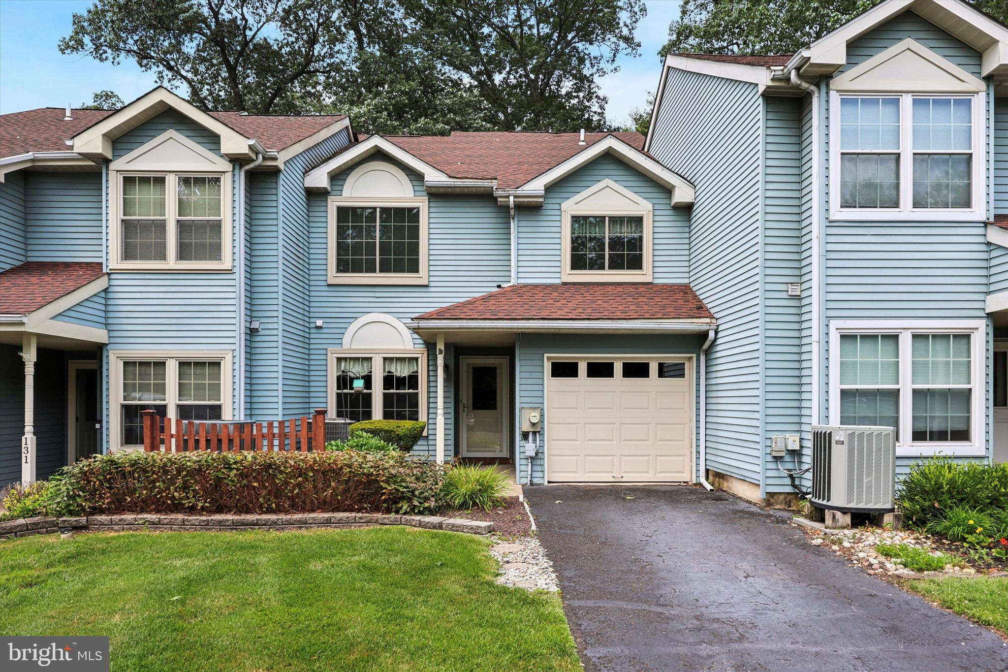 Located in Horsham's Saw Mill Valley subdivision at the end of a cul de sac street, you’re going to love the layout of this home, the setting, and its potential. Located in a wooded setting and just a short walk to Horsham’s Power Line Trail system with miles of paved walking/running/biking trails and also within walking distance to multiple township parks, with access to the outdoors and to a quick morning workout. These townhouses were among the last in the development to be built, and they have some great modern details including vaulted ceilings in the bedrooms and in the primary bathroom, and this model also has a soaring 2-story living room with a bank of windows on the rear wall that flood the space with natural light and sight lines of the wooded space behind. On the main level there is a large eat-in kitchen, a powder room, access to the 1-car attached garage and a dining room with sliding door to the rear deck as well as the living room with a wood burning fireplace to take the chill off of cold winter nights and create some ambiance after a long day. Upstairs, you'll find two generously sized bedrooms, each with ceiling fans and ample closet space. The upper-level laundry adds everyday ease and functionality, making chores a breeze. Enjoy morning coffee or evening relaxation in the peaceful backyard, which backs to a tranquil tree line—offering privacy and a touch of nature right outside your door. The attached garage and extended driveway provide parking for up to 3 vehicles, a rare find in townhouse living. While the home could benefit from some cosmetic updates including paint, flooring, and some sprucing up in the bathrooms and kitchen, it is move-in ready with solid bones and loads of potential to make it your own AND at this price, it’s an incredible opportunity to create some sweat equity and add loads of value as you update. The HVAC system and water heater were replaced in 2019, and many of the windows have also been replaced. The roof was also replaced just 7 years ago. Whether you're a first-time buyer, downsizer, or investor, this is a fantastic opportunity to own in one of Horsham’s most beloved communities. Come visit 133 Sarahs Lane and find your way home!