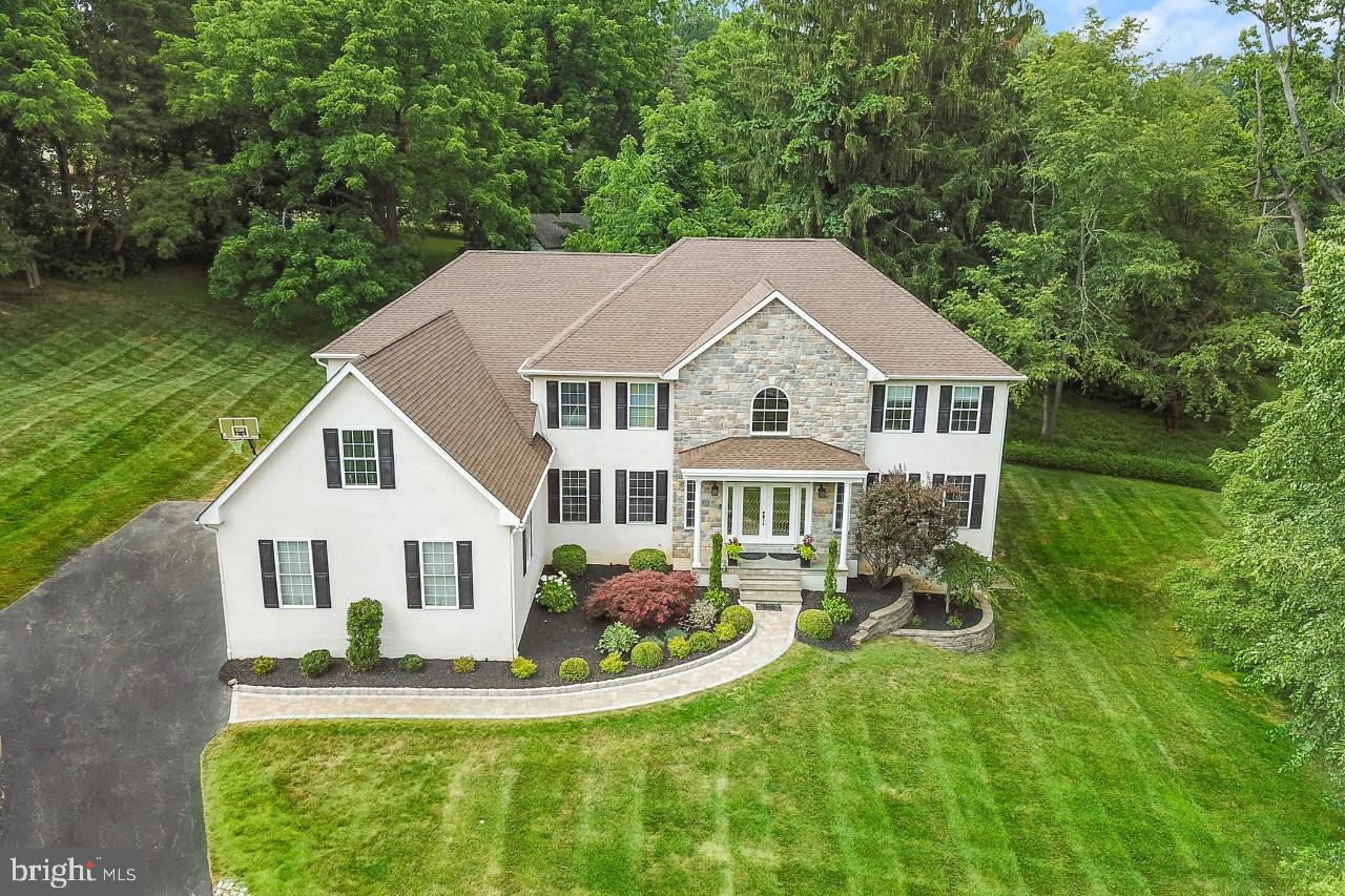 Welcome to 180 Clearwater Drive, a stunning, 5,900 SF custom-crafted retreat nestled in Media, PA. This impressive 5-bedroom, 5.5 bathroom home offers an unparalleled blend of luxury, convenience, and sophistication. As you enter the grand foyer, the magnificent two-story entry welcomes you into a world of extravagant living. Immerse yourself in the richness of the Brazilian cherry hardwood floors and 10' high ceilings that flow seamlessly throughout the main living area. The expansive custom gourmet kitchen serves as the heart of the home, outfitted with a gas cooktop, an abundance of cabinetry, granite countertops, and complemented by a cozy gas fireplace. Adjacent to the kitchen is a welcoming family room with its own fireplace, perfect for relaxation and entertainment. A dedicated office/library space offers a tranquil work environment, while the formal living room and dining room provide sophisticated settings for hosting guests. Front and rear staircases provide access to the second floor, which features Brazilian cherry hardwood floors in the hallway. The master suite is a sanctuary of luxury, featuring a spacious sitting area, a comforting fireplace, three generous walk-in closets and an en-suite bath with a jacuzzi. Each of the additional four bedrooms are equally substantial and include private full baths, ensuring comfort for every member of the household. The expansive walkout basement provides ample storage space and potential for further customization. Outdoors, the patio with E.P. Henry pavers offers a serene, expansive area ideal for relaxation or entertaining in the tranquility of your private backyard. Custom finishes and high-quality amenities handpicked resonate throughout the home, exemplifying a refined aesthetic. The inclusion of a geothermal HVAC system provides not only a comfortable living environment but also cost-effective energy use. Conveniently positioned near major roadways, Philadelphia International Airport, City of Philadelphia, Media and the Mainline. 180 Clearwater Drive is not just a home, but a lifestyle, offering a unique combination of comfort, luxury, and location. This home is a must-see for those seeking a residence that delivers on all fronts.