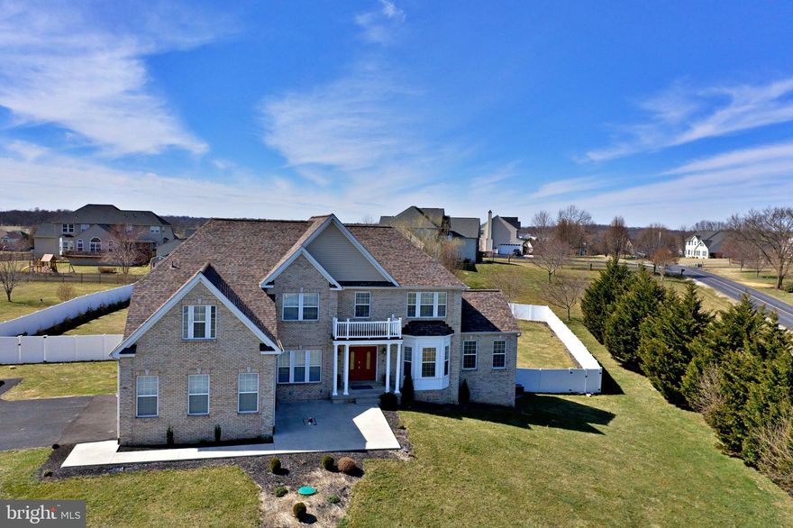 This incredibly spacious brick-front Colonial has been gloriously freshened up and is ready for you to call it "home"! NEWER roof, siding, septic system, dishwasher, and microwave/convection oven. All hardwood and tile flooring on the main level, brand NEW carpet upstairs, and most of the house has been freshly painted in neutral colors. The open floor plan features a grand two story foyer, formal living and dining rooms, large family room with floor to ceiling stone fireplace, and a fantastic kitchen with granite countertops, tile backsplash, walk-in pantry, and stainless appliances. For this new work-from-home era, there are both a formal office and also a lovely sun room/sitting room that would make a great office space as well. Two stairways lead to the second level which contains five bedrooms, four of which have their own attached baths, and the laundry room. The master suite is complete with a cozy gas fireplace, sitting/dressing area, two large walk-in closets, separate vanities, and a large soaking tub. The mostly finished walk-out basement offers plenty of recreation space and tons of room for storage. The exterior amenities make this property fantastic for entertaining with its front and rear concrete patios, fully vinyl fenced back yard, and in-ground heated and cooled, saltwater, fiberglass pool with slide.