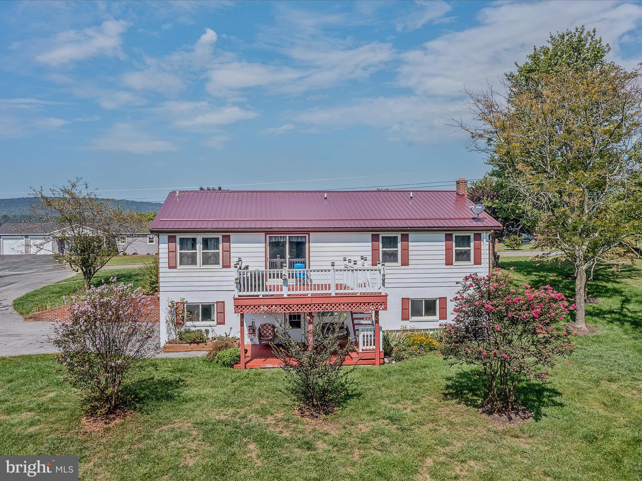 Ranch home just minutes from historic downtown Berkeley Springs. Home offers 2 levels of living with this well maintained and recently renovated home. Upstairs you will find 3 BR and 2 BA with a lovely back deck taking in the beautiful mountain view. The bottom level has a beautiful back patio also for enjoying the mountain view and relaxing with that morning coffee. There are 2 BR and 2 BA with this level. A large walkin closet that is sure to please! Bottom level can be sold fully furnished. Each level has its own laundry as well. The home's roof and gutters were newly installed in 2023 with all exterior painting completed as well. Whether you are an investor looking for a rental or someone who is looking to live upstairs and have a tenant downstairs or perhaps a family member or friend downstairs, this one is perfect for you. NO SHORT TERM RENTALS ALLOWED. 2 storage sheds. Each storage shed has power. Perfect for storage, office, studio or even a kennel for your furry friends
