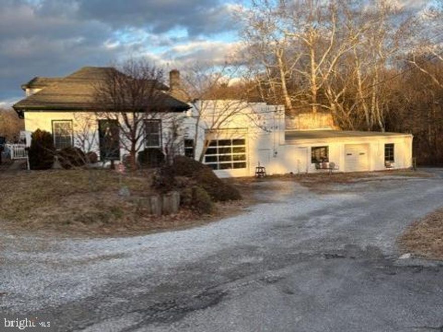 6,634 sq ft masonry industrial building suitable for multiple tenants.  Located on Jefferson Blvd (MD Rt 64) with a traffic count in excess of 11,500 cars daily and convenient to both Hagerstown and Frederick.  Partitioned into 3 sections, each with separate heat, 3-phase electric, and restroom facilities.  High bay with 12’ overhead doors.  Includes a 2-BR dwelling that could also be utilized as office.  Almost 3 acres of highly stabilized and secured gravel parking.  Potential uses include contractor with yard, manufacturing, auto service, and storage.  Potential gross income of $6,000 per month.  Heavy duty shop crane included.  Owner-agent.