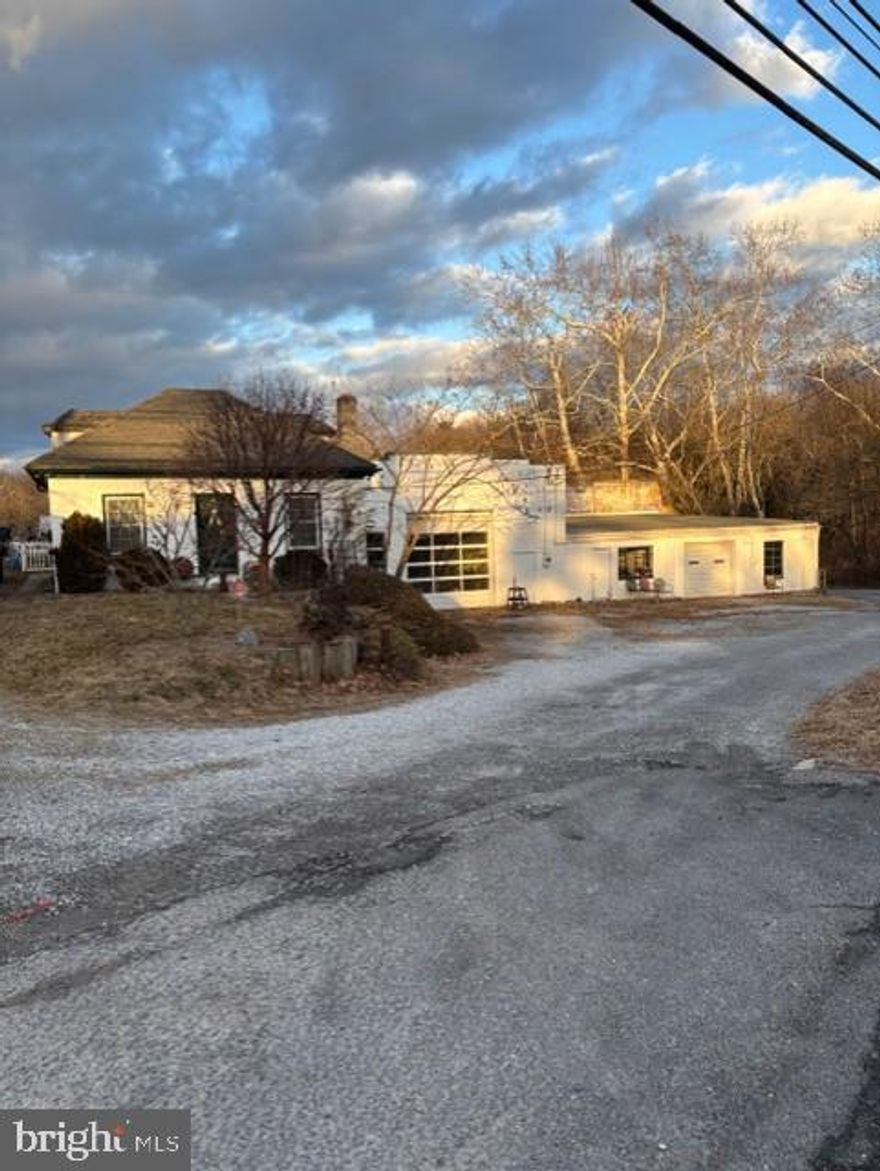 6,634 sq ft masonry industrial building suitable for multiple tenants.  Located on Jefferson Blvd (MD Rt 64) with a traffic count in excess of 11,500 cars daily and convenient to both Hagerstown and Frederick.  Partitioned into 3 sections, each with separate heat, 3-phase electric, and restroom facilities.  High bay with 12’ overhead doors.  Includes a 2-BR dwelling that could also be utilized as office.  Almost 3 acres of highly stabilized and secured gravel parking.  Potential uses include contractor with yard, manufacturing, auto service, and storage.  Potential gross income of $6,000 per month.  Heavy duty shop crane included.  Owner-agent.