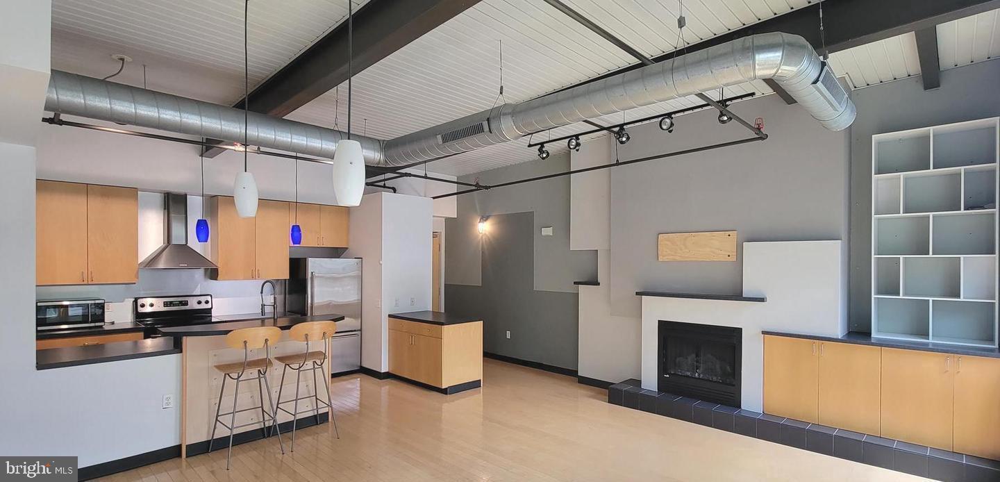 Welcome to this beautiful 2 bedroom, 2 bathroom condo located in the heart of Conshohocken, PA. This recently renovated unit features 1,092 square feet of living space with modern finishes throughout, including a fully updated kitchen with stainless steel appliances.
The spacious living area features large windows that let in plenty of natural light and a cozy electric fireplace, perfect for relaxing. The primary bedroom features an ensuite bathroom with a large walk-in shower and stylish fixtures, while the second bedroom is ideal for guests or a home office. This condo also features an in-unit washer and dryer. Building amenities include a fitness gym and common area room with a pool table, bar, and flat-screen TV. There is also a patio used for outdoor grilling and dining for personal use. Secure key card access to the garage and building for added safety.
Conveniently located about 15 miles northwest of Center City, Philadelphia, and 24 miles from the Philadelphia International Airport this prime location is also just a short walk from all the shops, restaurants, and entertainment options that Conshohocken has to offer, as well as The Schuylkill River Trail minutes away that offers about 60 miles of finished bike trail you can use to ride to Philadelphia or Valley Forge National Park. this unit is perfect for anyone looking for a convenient and comfortable lifestyle. In addition, this unit comes with Garage parking which includes one assigned spot and one shared guest spot, with additional off-street parking available in front of the building (no permit requirements)
Don't miss your chance to rent this beautiful condo in one of Conshohocken's most desirable locations!
UNIT AMENITIES
+ Air Conditioning
+ High Ceilings
+ Assigned Parking
+ Dishwasher
+ Washer/Dryer
+ Hardwood Floor
+ Carpet
+ Fireplace
+ No Cats, Small Dogs Allowed