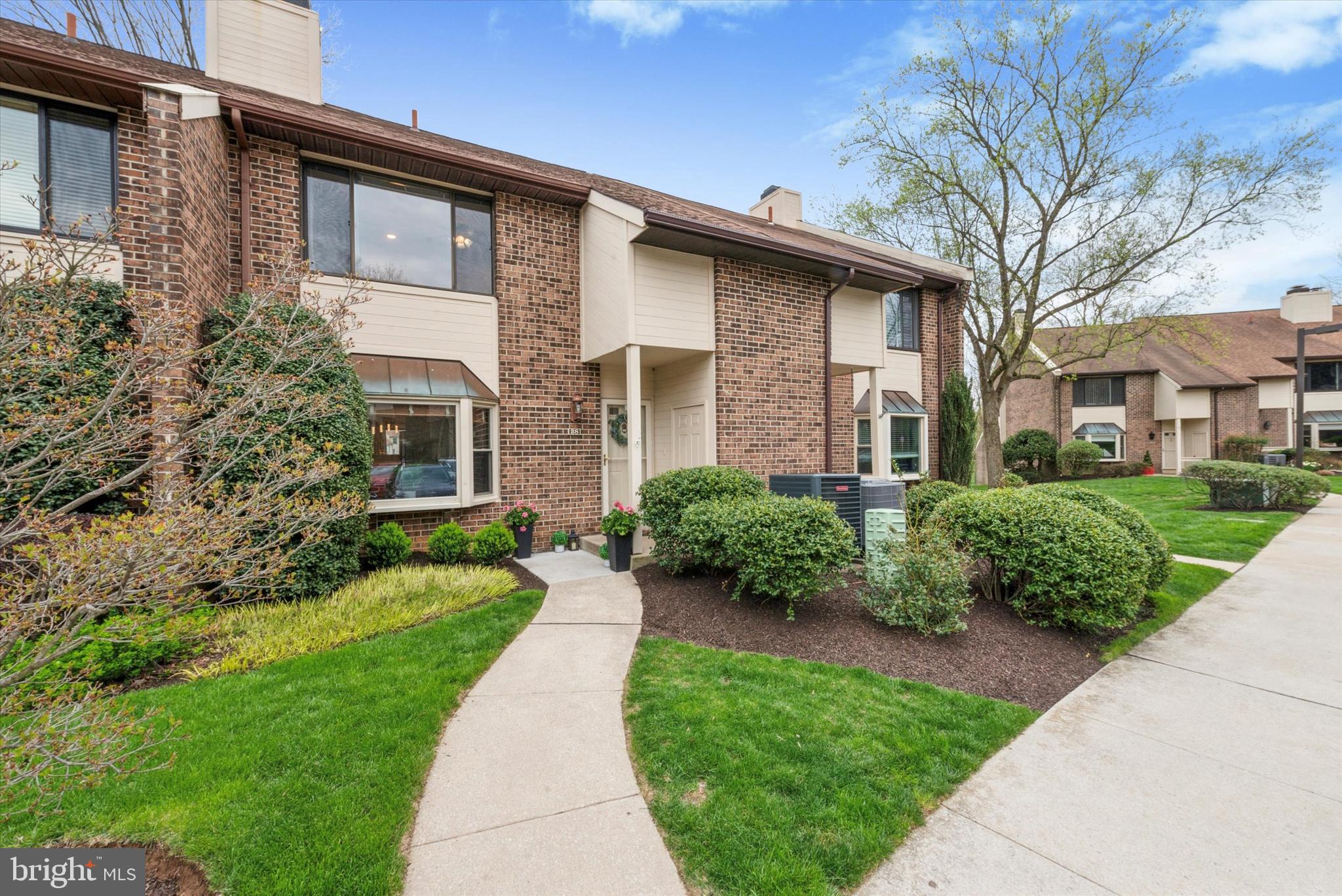 Welcome to 28 Elan Lane, a bright and beautifully updated townhouse in the sought-after and top-rated community of Chesterbrook, located within the award-winning Tredyffrin/Easttown School District. This light-filled home combines modern upgrades with a spacious, versatile layout and an unbeatable location just steps from Wilson Farm Park. The first floor has been thoughtfully reimagined with walls removed to create a seamless open-concept flow between the kitchen, dining, and family rooms, which open to a deck overlooking community green space—perfect for entertaining or relaxing. The recently renovated kitchen features new granite countertops, white shaker-style cabinets, and stainless-steel appliances. A cozy fireplace and bay window enhance the main level living room, which can also serve as a studio, library, or home office. A convenient powder room and closet complete this level. Upstairs, the primary suite offers three walk-in closets, a large bright window, and an en suite bath with a walk-in shower and new vanity. Two additional spacious bedrooms and a completely remodeled hall bath are finished with stylish porcelain tile flooring and a tub/shower surround with a built-in shampoo niche. Laundry is conveniently located on the second level. The third floor is a flexible loft that can be used as a fourth bedroom, office, or creative studio and features ample storage space, perfect for seasonal items or extra belongings. The fully finished walk-out basement includes two versatile spaces: a large open living area with sliding door access to the patio and grassy open space, and a private room ideal for a home gym or office. This room includes a window that looks out to the community green space, bringing in natural light and a connection to the outdoors. A powder room and additional closet space are also found on this level. Buy with confidence—this home offers a newer roof and HVAC system. Recent improvements include full kitchen and hall bath renovations, recessed lighting throughout, freshly painted walls, and wide luxury vinyl plank flooring on the main level. Enjoy being less than a minute’s walk to Wilson Farm Park with its walking trails, playgrounds, and sports fields. Conveniently located near top-rated schools, major highways, shopping centers, and regional rail lines, this home truly has it all.