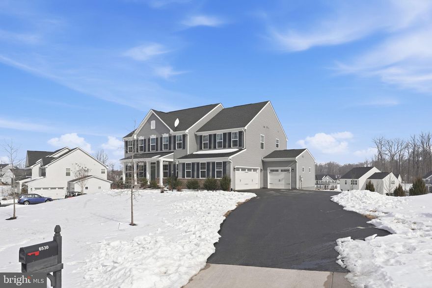 Welcome to this stunning 4-year-young single-family home offering modern design, thoughtful layout, and exceptional space across three beautifully finished levels, all situated on over half an acre. The bright and open main level is designed for both everyday living and entertaining. At the heart of the home is a gourmet kitchen featuring quartz countertops, a large center island with seating for four, double ovens, and abundant cabinetry, a chef’s dream! Just off the kitchen, step out onto the deck, perfect for morning coffee, outdoor dining and entertaining. The seamless flow into the dining and living areas creates an inviting space filled with natural light. A main-level bedroom adds flexibility for guests, multi-generational living, or a private home office. The oversized mudroom provides incredible storage and organization. Upstairs, you’ll find four spacious bedrooms, including a luxurious primary suite with a private bath. A versatile loft overlooking the two-story foyer, offers the perfect space for a second living area, study zone, or playroom. The fully finished basement expands your living space even further with an additional bedroom, full bath, large recreation room, dedicated media room, and a large storage area. This home is close to major commuter routes, shopping, restaurants and more! WELCOME HOME