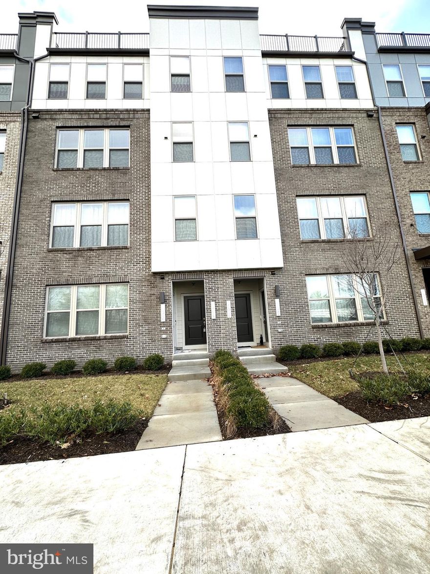 This pristine and luxurious, 2023 built  3-bedroom, 2.5-bath, upper-level two-story condo townhouse with a 1-car garage is ideally located in the heart of Herndon, ready to welcome new tenants. Water utility is included in the rent, offering added convenience. The main level features a stunning gourmet kitchen with extended countertops, ample cabinetry, a spacious pantry, and an additional storage closet. Equipped with premium GE Profile stainless steel appliances—including a double wall oven, cooktop, built-in microwave, and dishwasher—this kitchen is a chef’s paradise. The formal living and dining areas are perfect for entertaining, while a private balcony provides a relaxing retreat, complete with extra storage. Elegant hardwood floors flow throughout the entire main level, adding warmth and sophistication. Upstairs, you’ll find two generously-sized bedrooms with plenty of closet space and a hallway bath with dual vanities and a soaking tub. The expansive primary bedroom offers a large walk-in closet and a luxurious en-suite bathroom with separate his and hers vanities and a standing shower. Additional perks include a $100 repair deductible and a prime location within walking distance to Clock Tower Center, restaurants, and shops. You’re also just minutes away from Innovation Metro Station, major commuter routes, and the airport. This beautiful home is available now—don’t miss your chance to make it yours!