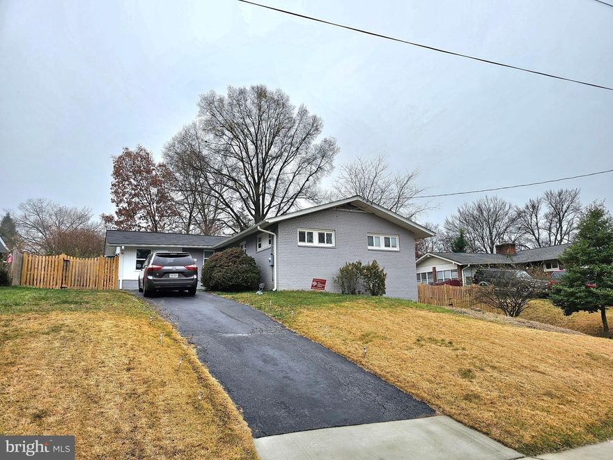 AVAILABLE FEBRUARY 1ST. This beautifully updated single-family home, renovated in 2019, offers modern living with ample space for comfort and convenience. The main level features 3 spacious bedrooms and 2 full baths, including a large primary suite with a walk-in closet and an ensuite bath. The updated ensuite bath boasts modern tiles, a shower with a frameless sliding glass door, and an updated vanity. The heart of the home is the open-concept living area, which seamlessly blend the kitchen, dining area and living area together with a walkout to the back deck and fenced-in yard.

The kitchen is a chef's dream with sleek Quartz countertops, a large center island, and premium graphite stainless steel appliances. Enjoy the elegant tile backsplash, French door refrigerator with freezer drawer, glass-top stove, built-in microwave, and dishwasher. 

The lower level of the home features an expansive L-shaped recreation room, complete with a cozy electric fireplace, a walkout to the side yard, and a large finished storage room. This level also includes a 4th bedroom and a full bath, along with a dedicated laundry/utility room, making it ideal for guests or additional family living space.

Located in the heart of Fairfax, this neighborhood is known for its peaceful residential setting while being just minutes away from the bustling amenities of the city. Nearby, you'll find a variety of parks, recreational facilities, and green spaces, perfect for outdoor activities, walking, or picnicking. The area is also home to excellent schools.

For shopping and dining, the home is close to several retail centers such as the Fairfax Corner and Fair Oaks Mall, which feature a wide range of stores, restaurants, and entertainment options. Commuters will appreciate the convenience of nearby major highways, including Route 50 and I-66, offering easy access to Washington, D.C., and surrounding areas. The proximity to public transportation, including the Vienna Metro Station, makes commuting simple and efficient.

Don't miss the opportunity to own this updated gem with fantastic features and a versatile layout in a desirable neighborhood!