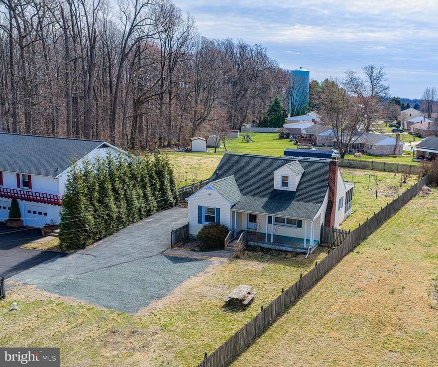 LOCATION ! LOCATION! NO HOA . This charming Cape Cod style home is nestled on a private half acre lot down an estimated  300 foot paved shared driveway that can not be seen from the main road. ( Route 22) . The front porch is a great place to relax & unwind from a busy day.  The spacious living room features a cozy wood burning fireplace  with glass doors that is surrounded by a beautiful wooden mantel.  This home's character abounds as you pass through the archway into the dining room  featuring a sparkling chandelier which is a wonderful place to entertain your guests.  The beautiful wooden trim & doors throughout the home give this home a nostalgic feel.  The kitchen adjoins the dining room and has an exit door to the screened porch & backyard.  The large level backyard has plenty of room for an outside activity such as gardening . There is a huge shed for storage of all your lawncare items. Back inside the home , there are two nice sized bedrooms  on the main level that share a full bathroom.  The upper level of the home hosts a large third bedroom, a hobby/craft room with large closet (hobby table is included)  & a bonus room that could be used as a office. The lower level of the home has a bill Coe door exit to the backyard, private half bathroom with flush/toilet  only, utility sink,  workshop, built in shelving units & storage cabinets, sump pump with battery backup , reverse osmosis system for well water , large storage closet with shelving, This house offers the new owner a great opportunity for someone who is looking to complete the updates throughout to make this House their Home! The sellers desire to sell the home in AS IS condition. The sellers have paid in full the lease for the solar panels (Solar City/Tesla Solar Lease) . The some systems in the home estimated age are as follows: Roof 2011, Oil Furnace/hot water  2010, Vinyl windows 1999, new coat of Asphalt applied to driveway 2026 & newer large storage shed .   This sale includes two tax parcels : TAX ID #03-035700 (dwelling)  & TAX ID# 03-035727 ( driveway) . A shared driveway agreement & easement & plat is available upon request.