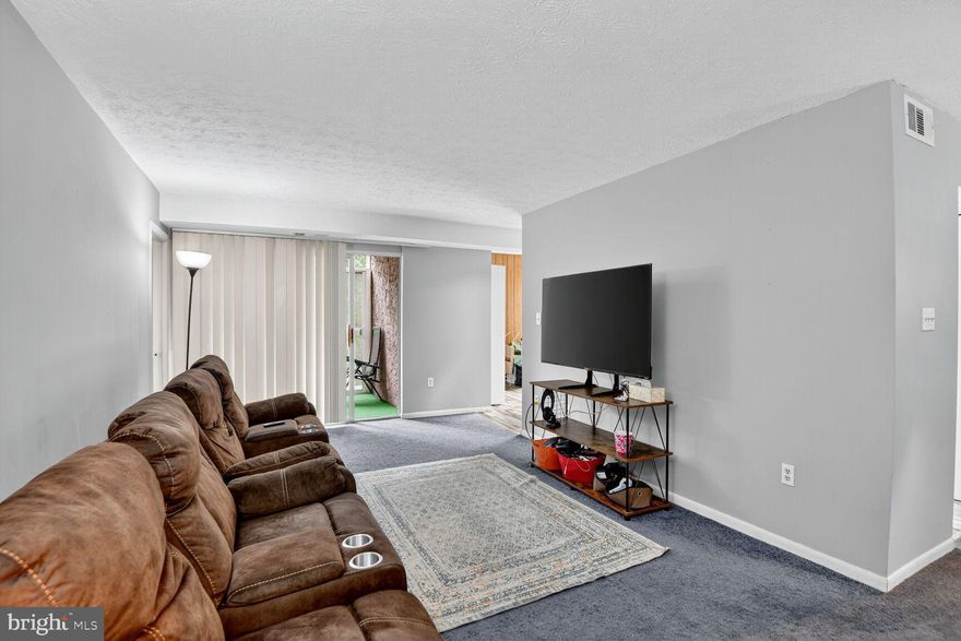 Condo fees have been REDUCED for this unit! Seeing is believing. All utilities included. 2BR + DEN lives like a 3rd BR. This spacious 2-bedroom + den + Guest room , 2-bath home has the versatility you’ve been looking for. The guest room, complete with a closet, door, and window, has served the current owners beautifully as a third bedroom, giving you options to fit your lifestyle. The den, just off of the kitchen creates additional work/play/dining space. 

Inside, you’ll find nearly 1,300 sq. ft. of living space, including a bright living room, separate dining area, and a breakfast nook that is the screened-in balcony. The kitchen and entry feature updated flooring, and the carpet throughout is in excellent condition. Both bathrooms offer convenience and have been refreshed.

Enjoy the community’s ample parking (with three tags included), nearby shopping, dining, and commuter access, all while living in an all utility inclusive condo that offers space, comfort, and value.