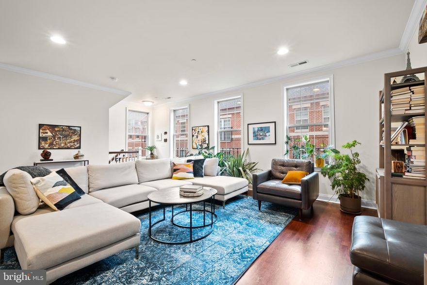 Nestled along a picturesque, tree-lined walkway in Naval Square- Philadelphia’s premier gated community- 112 Commodore Ct unveils a truly exceptional 23-foot-wide bi-level townhome just a short walk to both Rittenhouse Square & University City. This sun-drenched end unit features 8 extra windows, 3 spacious bedrooms, 2.5 baths, a private terrace and the ultimate convenience of an attached one-car garage.

Step into a bright and inviting open-concept living and dining area, beautifully enhanced with rich hardwood floors, two additional windows that fill the space with natural light, and an abundance of upgraded recessed lighting. The chef-inspired kitchen is a true showpiece, boasting elegant shaker-style cherry cabinetry, a tumbled marble backsplash, sleek granite countertops, and a full-size pantry. A premium stainless steel appliance suite includes a four-door Samsung refrigerator, Bosch dishwasher, stainless range, and a newer microwave — perfectly blending style and functionality. The adjacent family room space opens onto a full-length private terrace—perfect for relaxing or entertaining. 

Upstairs, retreat to the elegant primary suite, a serene haven featuring soaring vaulted ceilings, plush carpeting, and an expansive walk-in closet outfitted with custom California Closet built-ins. The spa-inspired en-suite bath offers dual vanities with granite countertops, a relaxing soaking tub, and a separate glass-enclosed shower. Two additional sun-drenched bedrooms—one also showcasing a second custom California Closet walk-in—share a beautifully appointed hall bath. A convenient laundry closet with washer and dryer and even more built-in storage completes this thoughtfully designed upper level.

Additional highlights include a convenient attached garage with built-in storage, plus a private hallway leading to the garage featuring custom built-ins—perfect for organizing everyday essentials. There’s also ample space to store bikes, strollers, and more, blending thoughtful design with effortless functionality.

Enjoy peace of mind knowing that all major mechanical systems have been recently updated, including the lower-level HVAC in 2025, the upper-level HVAC in 2023, and the hot water heater in 2022. Countless lighting upgrades throughout ( 5K).

Enjoy the ease of having the heated outdoor pool & state-of-the-art fitness center less than a minute walk from your building and the concierge close by. You’ll also love the convenience of having an Amazon Locker station right in the community. The dramatic community room in Biddle Hall rotunda is perfect to reserve for private parties. Enjoy the outdoor amenities of the 20-acre park-like setting: including picnic areas, well-kept gardens & mature landscaping. With a gated entry and on-site visitor parking, convenience and security are paramount. Very close proximity to South Street Bridge, UPenn (0.7 mi), CHOP, HUP & Drexel, Rittenhouse (0.9 mi) & Fitler Square. Fantastic restaurants and cafes, such as Rival Bros Coffee, Friday Saturday Sunday (James Beard Winner), Illata BYOB, Pub & Kitchen, Southgate, Sabrina's & Loco Pez, are all just steps outside the gates. The new Heirloom Market by Giant and South Square Market are only a block away. Directly out the back gate you will find easy access to the Schuylkill River Park, including the Award Winning Trail & Boardwalk, Markward playground, Tennis Courts & dog park! Naval Square is a pet friendly community allowing up to 2 pets with no weight restrictions. Don't miss this rare opportunity to own a piece of urban paradise in one of Philadelphia's most sought-after neighborhoods!
There is a special assessment with an additional monthly charge of $413.88 until Dec 2026. This is not reflected in the monthly condo fee of $740.16.
If possible, seller prefers mid- December settlement with rent back until January 11th 2025.