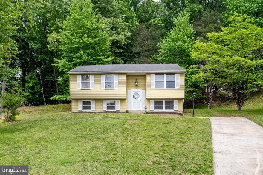 Fantastic opportunity to own a spacious split-level home on a quiet cul-de-sac in desirable Randallstown. Featuring 3 bedrooms, 2 full baths, and 1 half bath, this home offers a functional layout with great flow throughout. The kitchen includes granite countertops, a separate dining area, and opens nicely into the main living spaces, making it ideal for both everyday living and entertaining.  Step outside to a gorgeous flat backyard backing to trees, offering exceptional privacy and the perfect setting for barbecues, gatherings, or simply relaxing outdoors.  Conveniently located near 695, shopping, dining, and other everyday amenities, this home combines comfort, location, and value. While some cosmetic updates could make this home truly shine, it has already seen improvements and presents an outstanding opportunity for buyers to build equity in a well-established community.