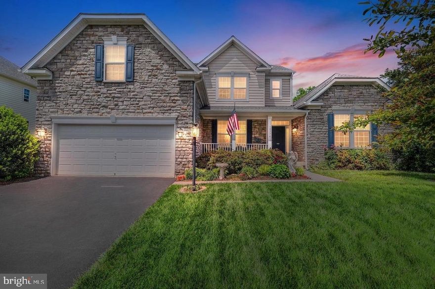 Discover a rare offering—only 3 of 294 homes in this community feature this coveted model with a main-level bedroom suite for easy, stair-free living. With 6 bedrooms, 3.5 baths, and 5,300+ finished sq ft across three levels, this home sits on .45+-acre lot backing to mature trees less than 2 miles to Quantico Marine Base. Inside, you’ll find hardwood floors, a gourmet kitchen with stainless steel appliances, granite countertops, cooktop, and double wall ovens, plus a sun-filled breakfast/sunroom and a dramatic two-story family room! The finished walkout lower level adds a large bedroom, full bath, generous rec room, workshop, storage, and a built-in vanity with plumbing—future wet bar ready. Outdoors, enjoy a fully fenced backyard for ultimate privacy. The main-level bath includes thoughtful accessibility features. Space, comfort, and location come together in a home that’s hard to find—don’t miss it!