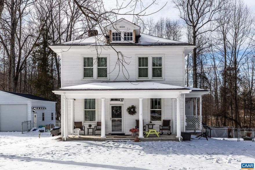 Experience the perfect blend of historic charm and modern luxury in this beautifully renovated 1939 Arts & Crafts farmhouse. Situated on a flat 1.188-acre lot in Louisa, this 2-story home features large, sun-drenched rooms and expansive windows that flood the space with natural light. The interior features a 2021 updated kitchen with stainless appliances, two redone bathrooms (2021), and stunningly restored original heart pine wood floors. Significant infrastructure updates provide peace of mind: New shingle roof (2022), well pump (2023), filtration system (2021), and both the oil furnace/HVAC and water heater were updated in 2018. Storage is abundant with a walk-up attic and an unfinished walk-out basement featuring an encapsulated crawlspace. Outdoor living is a dream with a classic covered front porch, a 25x25 detached garage, and a spacious, level backyard that is fully fenced and includes a chicken coop, perfect for your homesteading dreams. This move-in ready gem offers the character of a remodeled historic home with modern efficiencies.,Formica Counter,Painted Cabinets,Fireplace in Living Room