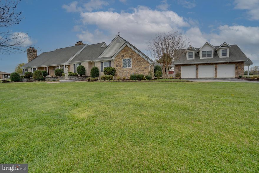 Gorgeous Brick & Stone 2 story 4 bedroom 3 .5 bath Home on 3.17 acres with 2 car Attached Garage and Large 3 Car Detached Garage that has an office/apartment upstairs. Entrance Foyer has ceramic tile floor with  curved hard wood stairway to second floor. Foyer with  decorative lighting leading to a Large First floor owners suite with sitting room and fire place and large bath with soaking tub, separate shower, washer and dryer.  Foyer gives access to a  Formal dining room off Kitchen and a  Large living room with Stone Fire Place. Fire place is see through to Family room that is adjacent to kitchen. Kitchen has granite counter tops with Island. Bridge way with sliding glass doors from kitchen  leads to  a Magnificent  Sun Room. Sun Room has a Bar, kitchenette and electric Fireplace and TV mount over the Fireplace. Sunroom  has separate HVAC unit. Great for Large family gatherings or watching NFL games on the Weekend. Asphalt drive way with plenty of parking turns left  into a Attached 2 car heated side load garage where you will enter in the 2nd Laundry room off kitchen.  Half bath off kitchen. Home has oil fired hot water baseboard heating system and Central A/C system. Second Floor has 3  large  Bedrooms, one Bedroom  with full bath. Another full bath on 2nd level hallway. Full unfinished basement with fire place and outside entrance. Covered walk way from home leads to a large detached 3 car garage with one bedroom apartment/Studio above garage.  2 sets of stairs serve this upstairs apartment.  Detached garage has a Separately metered electric system. L.P. gas for heating and a Central A/C for cooling. Also, Large roll up doors for larger Vehicles on this detached garage. Great for Classic cars or the home mechanic or small business.  A Lovely Rose garden and patio in back of home that is surrounded by a decorative stone wall can be access from the Bridgeway. Home has a  24 hour monitored Security system with Intrusion and Smoke  Alarm  detection system .   Most rooms are Freshly painted. Newly Landscaped gardens.  New exterior LED lighting with dusk to dawn control.  Large unfinished basement and Fireplace with outside entrance is  just waiting for your ideas and how to build out a new office, recreation room or for storage. Comcast provides TV and Internet. This home is close to schools and shopping but still in the country.  Square footage information thought to be correct. Buyers should verify all information contained in the listing.