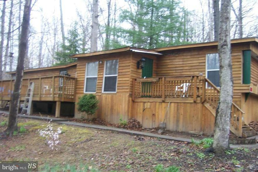 What an opportunity to live in one of Mother Nature Finest areas of PW. Spacious Decks on this prefabricated home overlooks a wooded wonderland. Fresh Paint and New Carpet!! Craftsman style exterior, plenty of storage, spacious rooms! Nature Abounds! Two bedrooms and two baths! Watch the birds while listening to the stream below from one of your private decks! Newer roof! Ready for new tenant!!