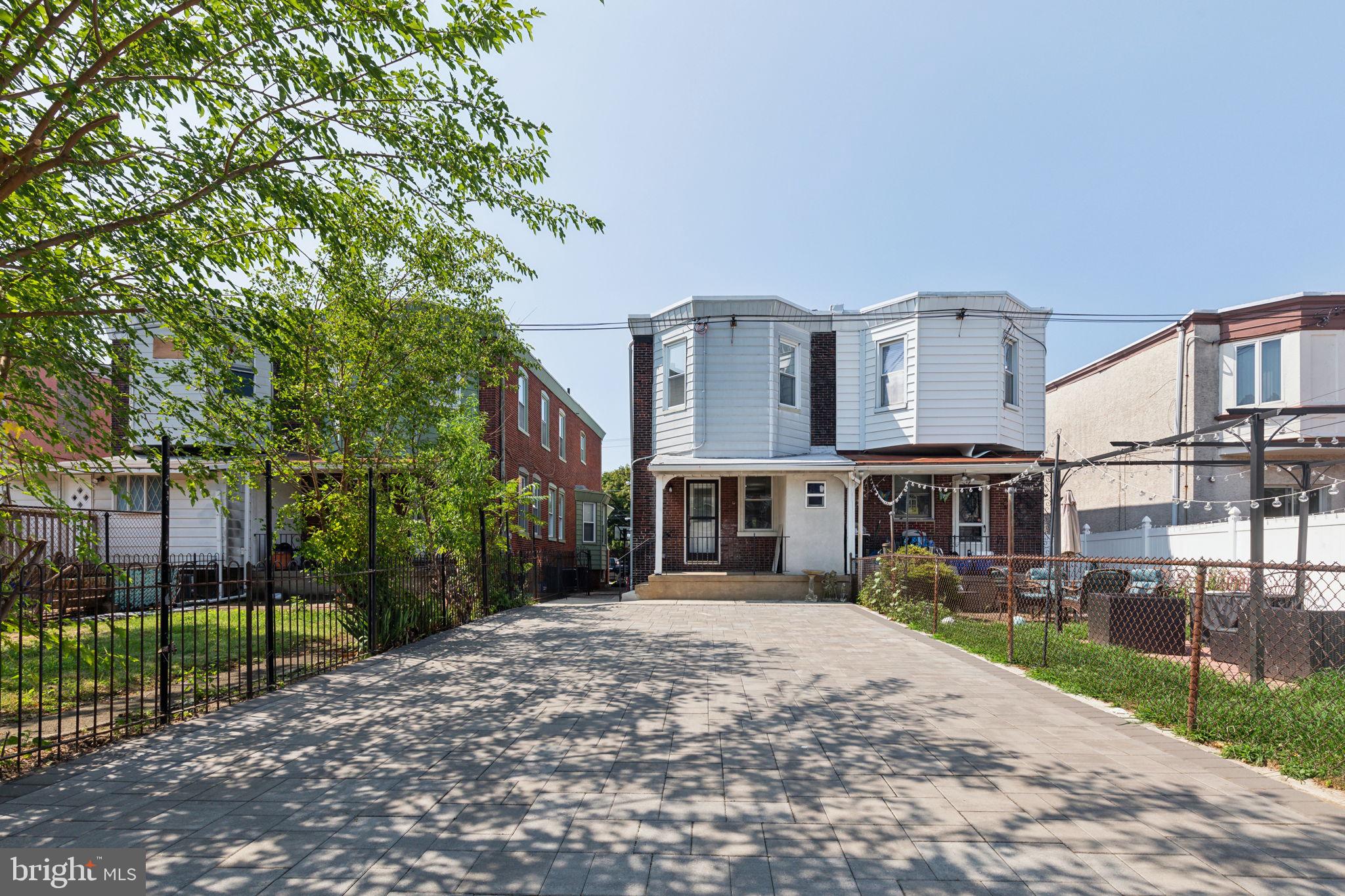 Here is your chance to own a rarely offered, street to street, historical twin, in the highly coveted Girard Estates with parking for up to four vehicles. Once you enter, you will be greeted with ample open space for living, dining, and entertaining. The kitchen features a peninsula for casual eats and functionality, all stainless steel appliances, plenty of cabinetry and space for Chef and crew. The half bath is conveniently located next to the back door entry for easy guest and personal access. Down the stairs, you will have a fully finished basement for whatever you can imagine. The mechanicals are located in the back, then you have the washer and dryer up front. On the 2nd floor, you have 2 standard bedrooms, a hallway bathroom, and a primary bedroom that has it's own bathroom. The pictures speak for themselves. Schedule a showing today!