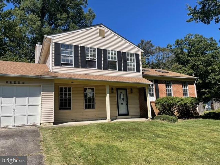 BACK ON THE MARKET.  Large Spacious split level with 4 bedrooms and 2.5 baths, full unfinished basement that could be additional living space. The main level has a bedroom that could be a library or office, family room with fireplace, a half bath and a separate laundry room. The first level has a large living room and dining area combination and leads into the eat-in kitchen that has some updates. The upper level has 3 bedrooms and 2 baths. The exterior features a screened porch off the family room and a large deck leading into the level yard.  There is a 1 car garage with a paved driveway and off-street parking for 2 cars.