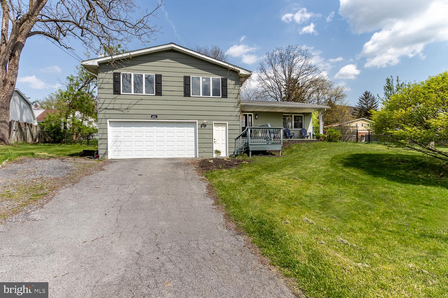 Completely Remodeled split-level home in Lemont! Move-in ready. This beautifully remodeled home combines modern comfort with a prime location, Three finished levels of stylish living space and an open-concept design. Bamboo hardwood flooring throughout. A gorgeous kitchen features lots of cabinetry, quartz countertops, an oversized 8’ island with bar seating, subway tiled backsplash, recessed lighting and stainless-steel appliances — perfect for everyday living and entertaining. The living room is highlighted by a 60” electric fireplace - complete with customizable flame color and temperature settings, and beautifully accented by a walnut mantle. Retreat to the spacious owner's suite, complete with a large custom walk-in closet and a luxurious private bath featuring a double walk-in tiled shower with a massaging shower panel and sleek glass doors. Three other nice-sized bedrooms and a full bath with dual sinks. Central air is an added feature and a brand-new front door with side windows. The finished lower level provides a cozy family room with a wood stove and half bath. .2-car garage and 35-acre lot fenced in and patio for relaxing. Walking distance to downtown Lemont, Mt. Nittany, Mountainside Park and a short distance to shopping, restaurants, coffee shop, and Penn State University. Welcome to your new home!