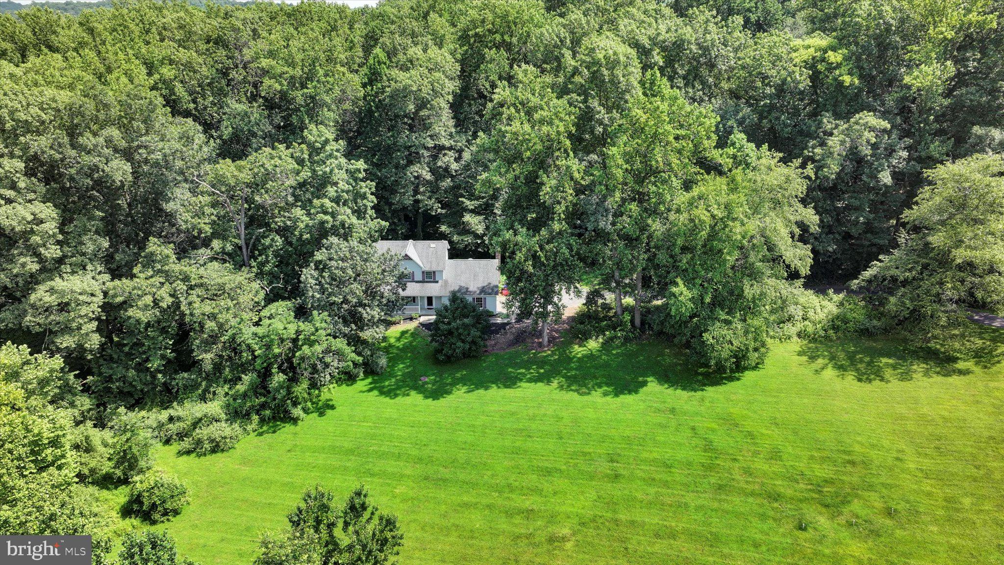 Get the BIGGEST BANG for your BUCK at 121 Lovell Lane! Yes, opportunity is knocking… Come and experience this charming Single Family Home in Downingtown S.D. on 2.6 PRIVATE Acres for only $550,000! Not a misprint! This 3BD/2.5BA Glenmoore Classic Colonial offers over 2,500SF of living space on 3-levels including the FINISHED, Walk-Out BASEMENT with a dedicated OFFICE/Flex Space, plus 2-Car Garage. This lovely home is nestled among the trees and sets back from the street -- enter the driveway at the base of the Cul De Sac. It's located in the Mapleflower Development -- a walkable neighborhood, but a very secluded lot -- Get the Best of both Worlds! If privacy is what you're after… this could be the one! This cutie is quite affordable and is in MOVE-IN Condition - just professionally cleaned – be in before school starts! Needs a little TLC -- but such a terrific value -- given the median sales price in Glenmoore hovers around $800K today! And attention to all those HGTV Fans... Dreams really do come true! If you've always wanted to tap into your inner 'Chip & Joanna Gaines' Fixer-Upper & design talents... here's your opportunity! Just bring your imagination and recreate your very own masterpiece … endless possibilities here! This lovely home offers: a nicely-sized OPEN-CONCEPT Kitchen with adjacent Breakfast Room, Family Room anchored with wood-burning fireplace, Living Room, Formal Dining Room and Powder Room rounds out the first floor. Three nicely sized bedrooms on the Upper Floor including a Primary Ensuite. Both Full Baths recently renovated. The Lower Level is fully finished with oversized Recreation Room containing a double-sided gas Fireplace and a dedicated Bonus Room/Flex Space – could serve as a great HOME OFFICE. Take advantage of the tremendous VALUE this home has to offer… with a few updates, this home could be a real STUNNER! Other highly desirable features include: CENTRAL AIR, awesome yard for the fur babies, hardwood and laminate flooring, stainless steel appliances (flat cooktop just replaced 2025), NEW! Hot Water Heater (July 2025), recessed lighting, ceiling fans in the bedrooms, tons of closet space throughout and you'll be greeted by an inviting front porch. Just minutes to major commuter routes including the PA Turnpike, Rts. 113, 100, 401, 322 & 30 and located in the top-rated Downingtown School District/STEM Academy! LOW TAXES = $5,610 (2025). No HOA. Estate Sale, home is being sold as-is.
+++SHOWINGS Begin: Friday, July 25th+++