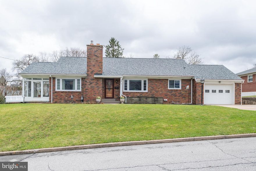 Is this the year for a 1 floor living option? Tough to find anything better for the price than this  Bellefonte Boro brick ranch on an oversized .67 acre lot-and NOW EVEN BETTER with a BRAND NEW ROOF! With 4 bedrooms and  2 updated baths, this home has lots to love and features a granite island kitchen with Amish built cherry soft close cabinetry, under cabinet lighting, and loaded with storage galore. Conveniently located off the living room you can step down into the relaxing vibe the 3 season sun room provides complete with an electric fireplace. Nicely finished walk out lower level has a full walk in shower, bedroom, laundry room, and family room with ANOTHER gas fireplace. Step outside and you’ll see a grilling pavilion and covered patio that comes with BOTH a gas grill AND  hot tub ideal for summer entertaining. Walk-up stairs lead to the unfinished attic and this could provide more storage or possibly future potential living space. Located at the end of a super desirable quiet dead end street with a wooded vacant Boro owned lot right next door, 20 different varieties of birds provide constant peaceful entertainment.. Gently lived in, this property is being sold “AS IS.” Sellers prefer a 30 day closing with a rent back until Jul 1. Room dimensions approximate. Buyer to verify.