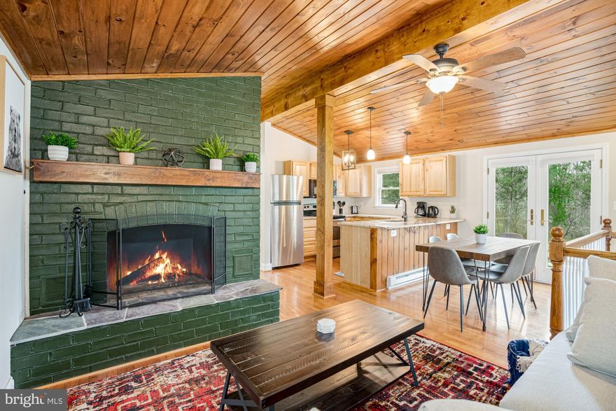 MULTIPLE OFFERS RECEIVED, BEST & FINAL BY SUNDAY AT 5PM.  Completely remodeled cabin located less than 10 minutes from downtown historic Harpers Ferry!  Beautiful granite counters, wood-burning fireplace, natural wood floors, cabinets & ceiling, finished basement, large wraparound deck, and a huge yard.  Professionally designed with all new furniture, modern decor, and hot tub. Seller spent over $38,000 upgrading the property.  As a vacation rental it has generated $81,000 over the past 19 months, and can come with an existing property manager and cleaner.

This cabin is located in Blue Ridge Acres, a private community with an outdoor pool, community Shenandoah River access and picnic area, and clubhouse and pavilion.

Hot tub and furniture optional, available for purchase.  See seller docs for a summary of rental history and financials.  $5,000 buyer credit if you continue using the same property manager.  Perfect vacation home or investment property!