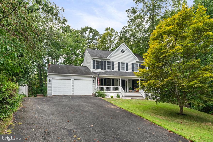 Stunning Updated Retreat that's one with nature in Gated Aquia Harbour – Assumable approx. 2.25% VA Loan!! (Call listing agent for details) Welcome to your dream home in the highly sought-after gated community of Aquia Harbour! Situated on a beautiful knoll, tucked into the trees, this charming  residence blends timeless elegance with modern luxury & offers an incredible opportunity with a VA assumable loan... With nearly 2,400 square feet of living space, this 4-bedroom, 2.5-bath home, 2 car garage is an entertainer’s dream and a peaceful retreat all in one. From the moment you step inside, you’ll be wowed by the custom built-in's, & designer wall treatments, to the  abundant natural light, and open-concept layout that make the main level feel grand and inviting. The renovated kitchen is a chef’s dream, featuring a beautiful brick accent wall with all recently replaced stainless steel appliances to include built-in double oven's, beverage cooler, cooktop, gray cabinets, and gleaming white quartz countertops! The spacious layout and sunny breakfast nook make this kitchen both stylish and functional. A formal dining room, family room with wood burning  fireplace  & vaulted ceilings, and access to the expansive  rear deck equipped with bar and outdoor TV, this beautifully updated home provides  ideal spaces for entertaining and relaxing. Upstairs, retreat to the enormous  owner’s suite, featuring vaulted ceilings, a walk-in closet, and a brand-new LUXURY spa-inspired en-suite bathroom with a  free standing soaking tub, walk-in shower, dual vanities, and vaulted ceilings. The additional three bedrooms are generously sized and share a renovated upstairs full bath. The lower level is a full size unfinished basement to provide more space and or ample storage. Direct access to all the amenities Aquia Harbour has to offer—marina, golf course, pools, clubhouse, trails, and security gate—this home truly has it all. Updated: New paint and carpet throughout -  Water heater replaced in 2024. Don’t miss your chance to own this exceptional home with water views, unmatched community amenities, and a once-in-a-lifetime loan opportunity. Schedule your private tour today!