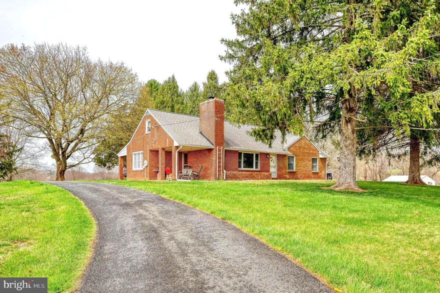 This charming all-brick rancher and 12 acre farmette is on the market for the first time ever! Situated in beautiful northern Harford County with stunning panoramic views for miles, the inviting home offers 3 beds and 1 bath, hardwood floors under carpet throughout, gracious front and back covered porches, picture window and fireplace with insert in the living room, generous bedrooms and many big-ticket updates for peace of mind, including 50-year roof in 2010, new boiler and well tank, and updated central AC in 2015. The walk-up attic and full basement offer options for storage or future finished living space. Outside, several outbuildings include a 3-stall barn ready for your horses, detached garage with attached shed and additional equipment/storage sheds. The property includes a small wooded area, tillable land currently being farmed with 2025 crops reserved, plenty of room for a garden and endless space to play and explore. Get away from the modern hustle and immerse yourself in the serenity of country living with easy sunny day visits to Eden Mill Park and Kilgore Falls just around the corner. Bring your plans and passion—this home is ready for its next chapter. Don’t miss your chance to turn homesteading dreams into reality on this one-of-a-kind property.