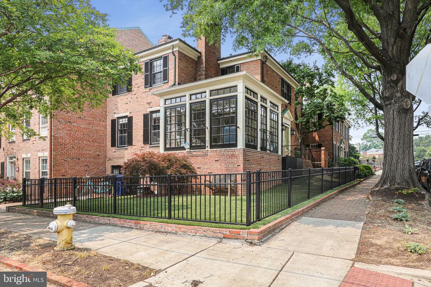 OFFER DEADLINE: Tuesday, June 13th @ 6 pm  If you've spent any time in Old Town, you've probably passed by this unique home with the gorgeous sunroom that sits like a diamond on display. Owners transformed this home one room at a time, maintaining all the classic elegance of the exterior balanced by the modern interior updates  this home longed for. The tiny galley kitchen was gutted and expanded to create space for walls of custom cabinets topped with a suite of high end appliances including an induction cook top and double wall ovens, sparkling marble that extends up the back splash, an expansive island offers plenty of space to dine or just hang out in the kitchen during meal prep.  French doors lead out to a cozy brick patio perfect for nights around a fire pit or morning coffee. Updated floors lead from the kitchen to a dining area and into a  spacious living room overlooking the front yard, anchored by a fireplace. The pièce de ré·sis·tance  on the main level is the sun room. Custom blinds can be whisked up and down to adjust the level of privacy by remote. Upstairs, the owners created a Primary Suite with room for a king sized bed that is a true oasis, with 2 walk in closets (a rarity in Old Town!), a gorgeous bath with a shower featuring hand laid tile to the ceiling and dual sinks. The second bedroom upstairs offers a spacious closet of its own and an appealing little fire place, with a full bath right across the hall. To top it off, the owners added a laundry station on the top floor! So no more taking the stairs with your laundry basket. The basement offers a guest suite complete with custom bunk beds, a renovated full bath, a laundry room of its own, and a cozy living room with plenty of space for an office AND room to binge watch your favorite shows. The lower level is rounded out with a room perfect for your home gym equipment and a door that you can slip out to your off street parking space. Not a stitch of wall to wall carpet anywhere in this home! Owners added a 2nd hvac to keep the top level comfortable, so this home now has dual zones. Don't delay! Schedule your private tour today!